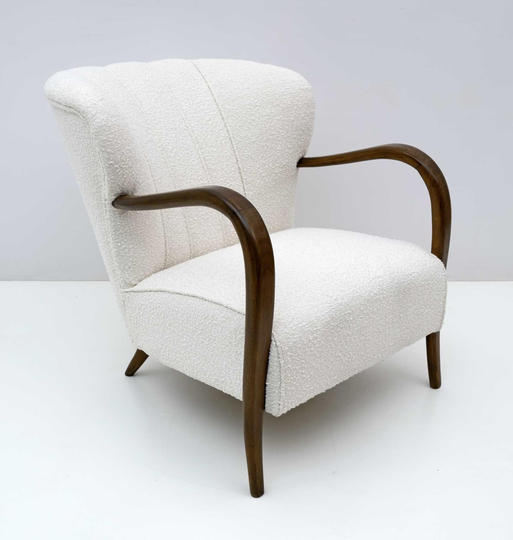 Comfortable armchair designed by Malatesta and Masson, Art Deco style, with rounded curves of great design, completely restored and upholstered in light ivory bouclé fabric. This lounge chair would fit perfectly in a living room as well as in the