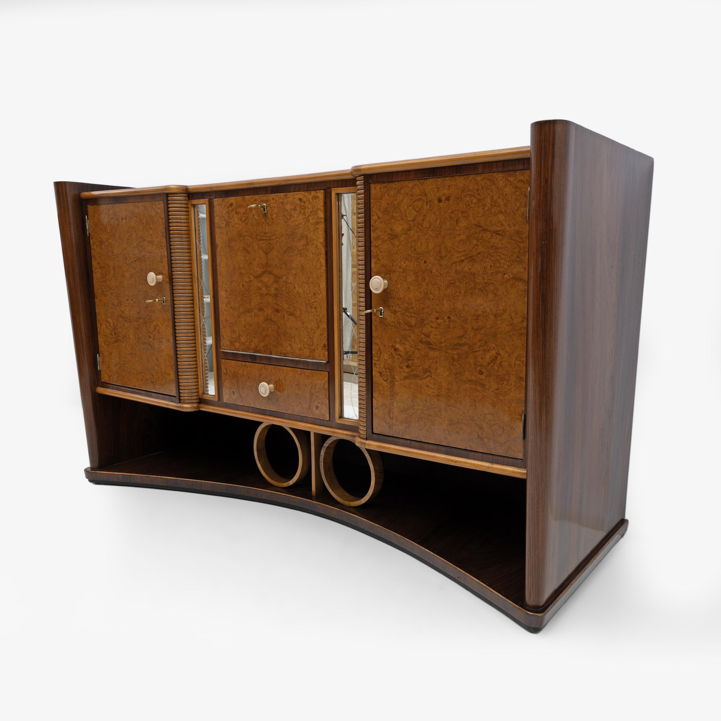 Original Art Deco sideboard in walnut, walnut burl and maple. Composed of two doors, a bar compartment in the center with a flap door, inside, mirrored lining, under the flap a drawer. The sideboard has been completely restored and polished with