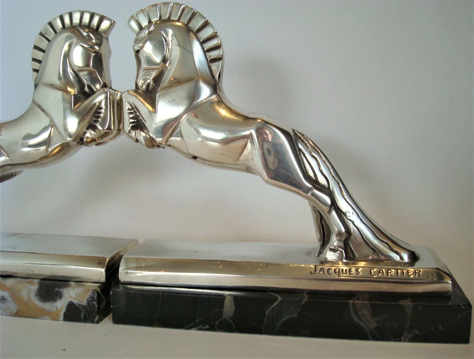 Art Deco Jacques Cartier horse bookends bronze sculpture. c 1925 France. A stunning pair of art deco stylized bookends. Silvered plated bronze Art Deco horse bookends by Jacques Cartier (French, 1907-2001). Both signed and numbered. Jacques Cartier