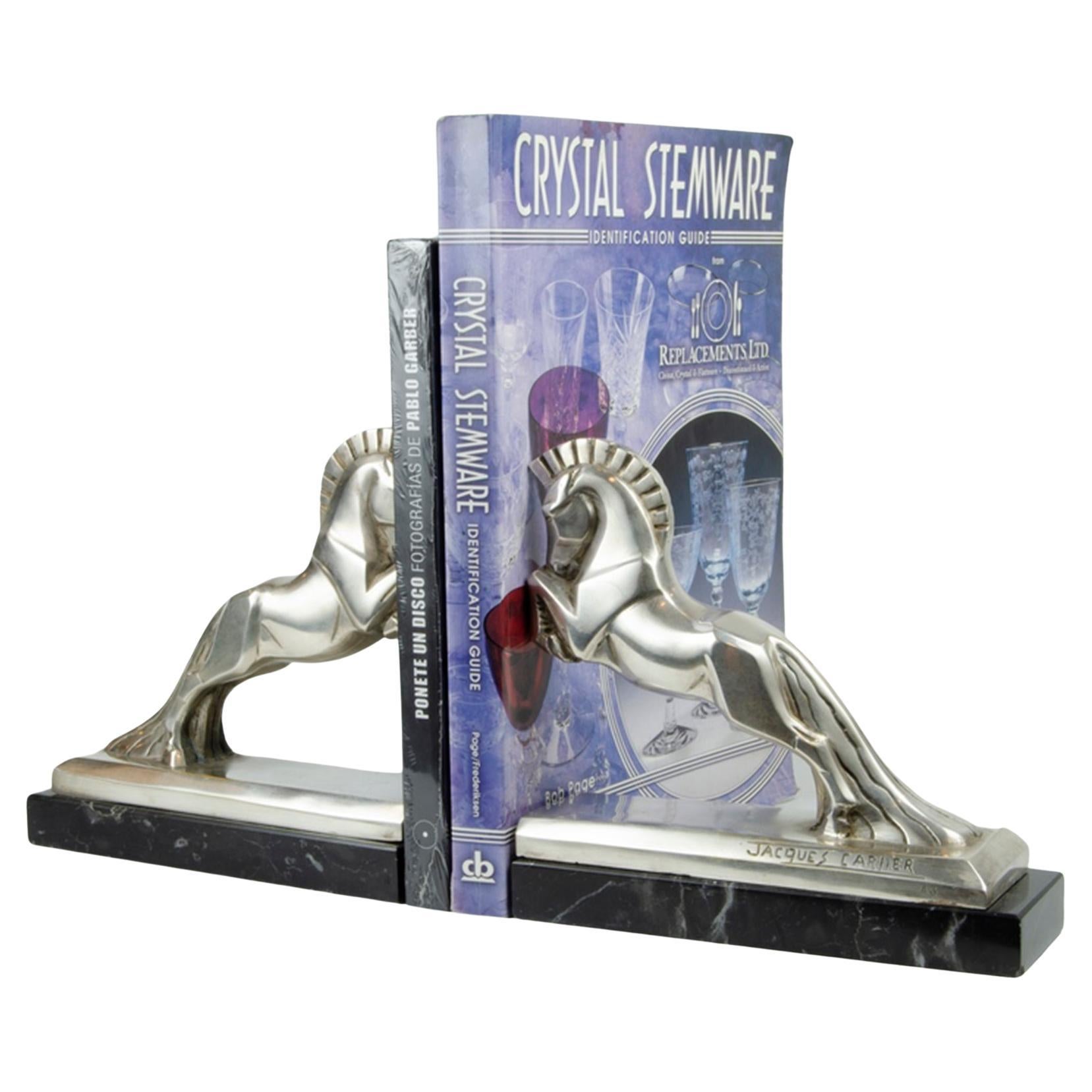Art Deco Jacques Cartier horse bookends bronze sculpture. c 1925 France. A stunning pair of art deco stylized bookends. Silvered plated bronze Art Deco horse bookends by Jacques Cartier (French, 1907-2001). Both signed and numbered. Jacques Cartier