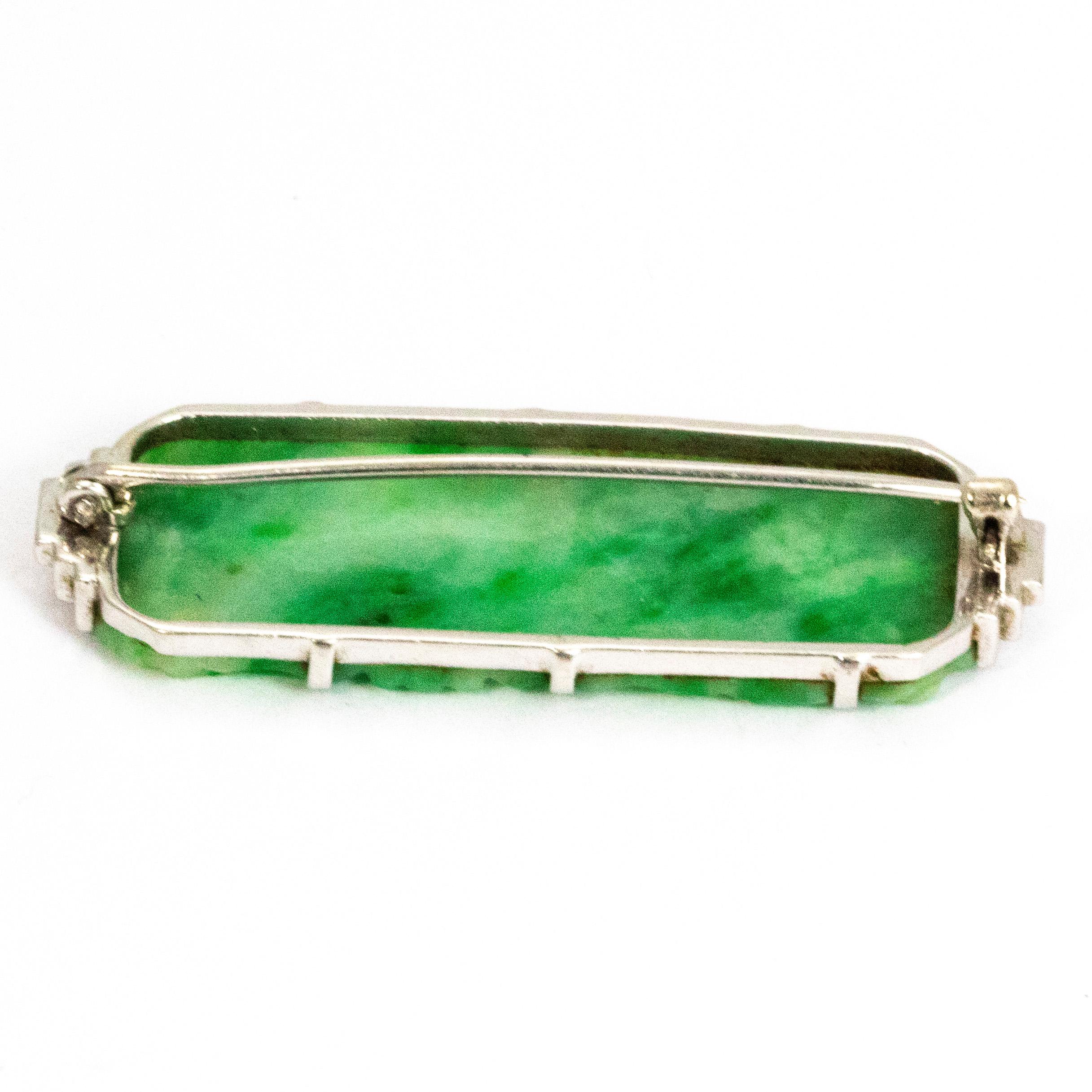 The engraving in this piece of jade is exquisite. The brooch has a classic Art Deco style to it which is shown with the white gold step detail either side of the stone. The glow when the light hits the jade is mesmerising. 

Brooch Domensions: 46mm