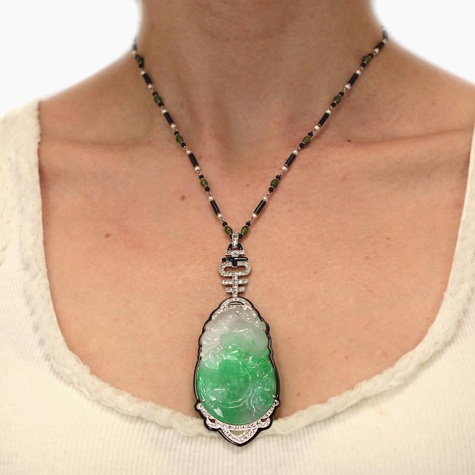 A beautiful intricate art deco jade necklace. The necklace  is also comprised  of old mine cut diamonds , small pearls and enamel. 