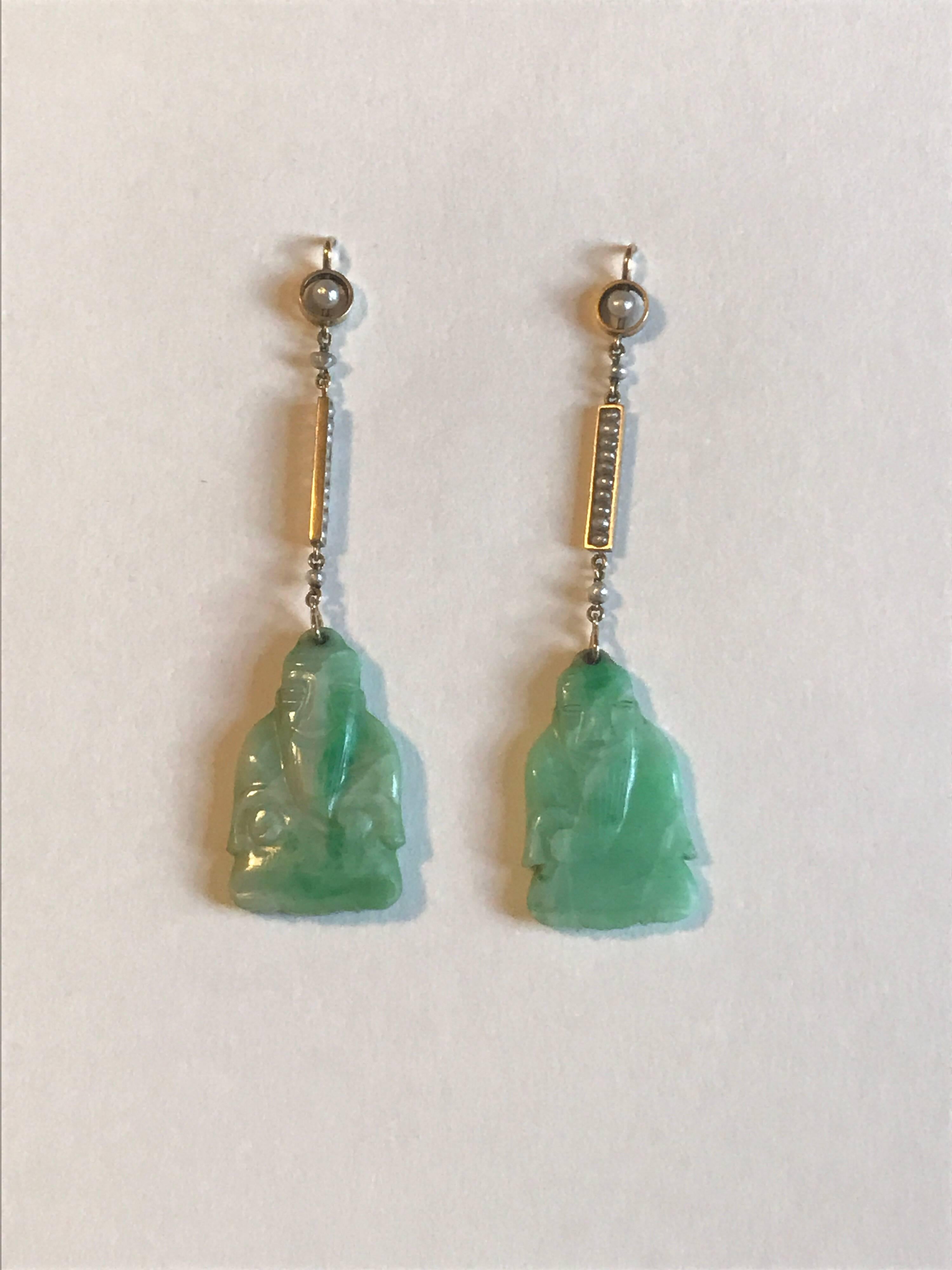 A pair of natural jade and natural seed pearl Art Deco period Buddha earrings set in hallmarked 15ct gold.  These are original art deco earrings which are in very good antique condition. There are no chips or cracks and the pearls are in good