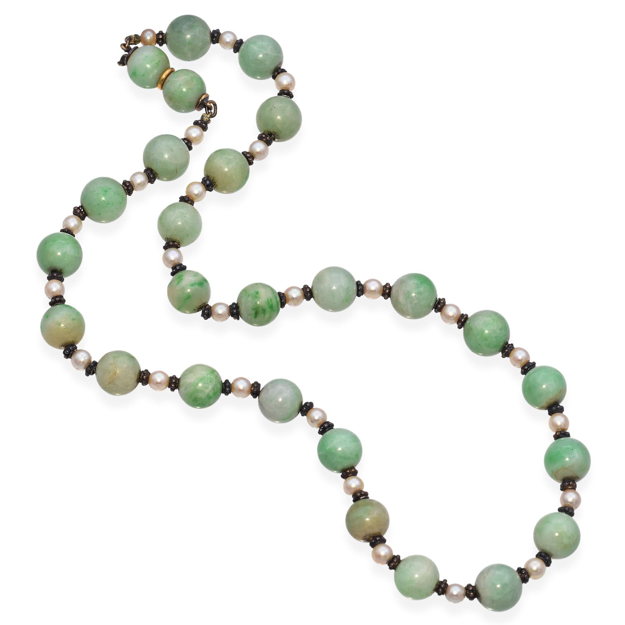 Early 20th Century Beaded Necklace with Green Jade and Pearl. This necklace features green jade beads, complemented by white pearls. The beads are strung together with silver accents, creating a harmonious blend of colors and materials.

Weight: