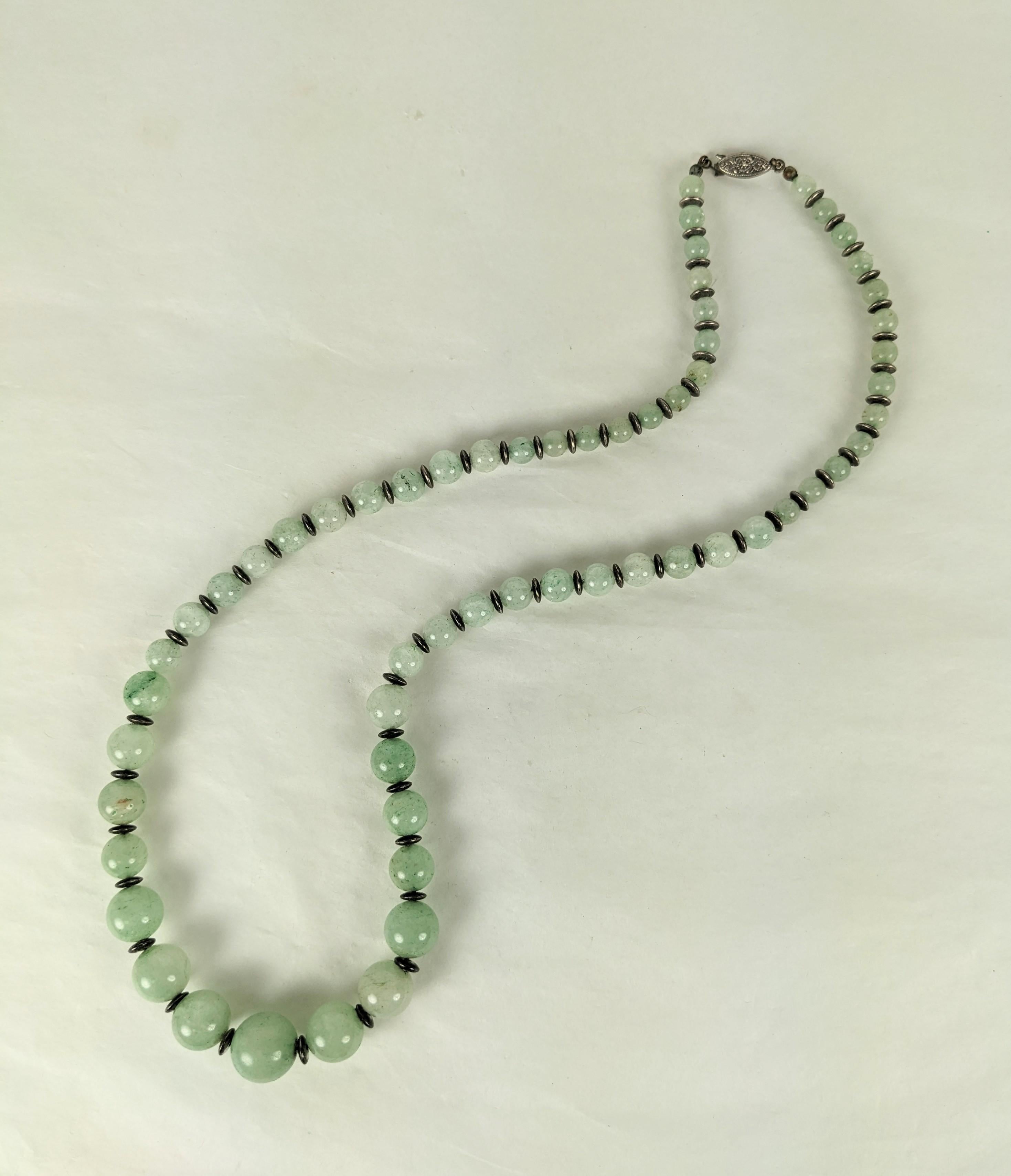 Elegant Art Deco Jade and Silver Bead Graduated Beads from the 1920's. Elegant design with graduated beads with silver disc bead connectors. 24