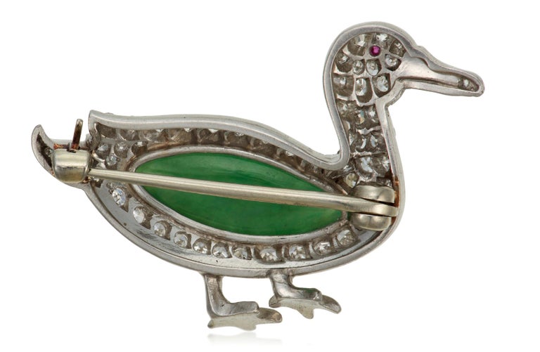 Art Deco Jade, Diamond and Ruby Duck Brooch 
Marquise-shaped cabochon jade, single-cut diamonds, round ruby, platinum and white gold, circa 1925
Diamonds: 60 single-cut diamonds with approximate total weight of 1.00 - 1.20 carats
Size/Dimensions: