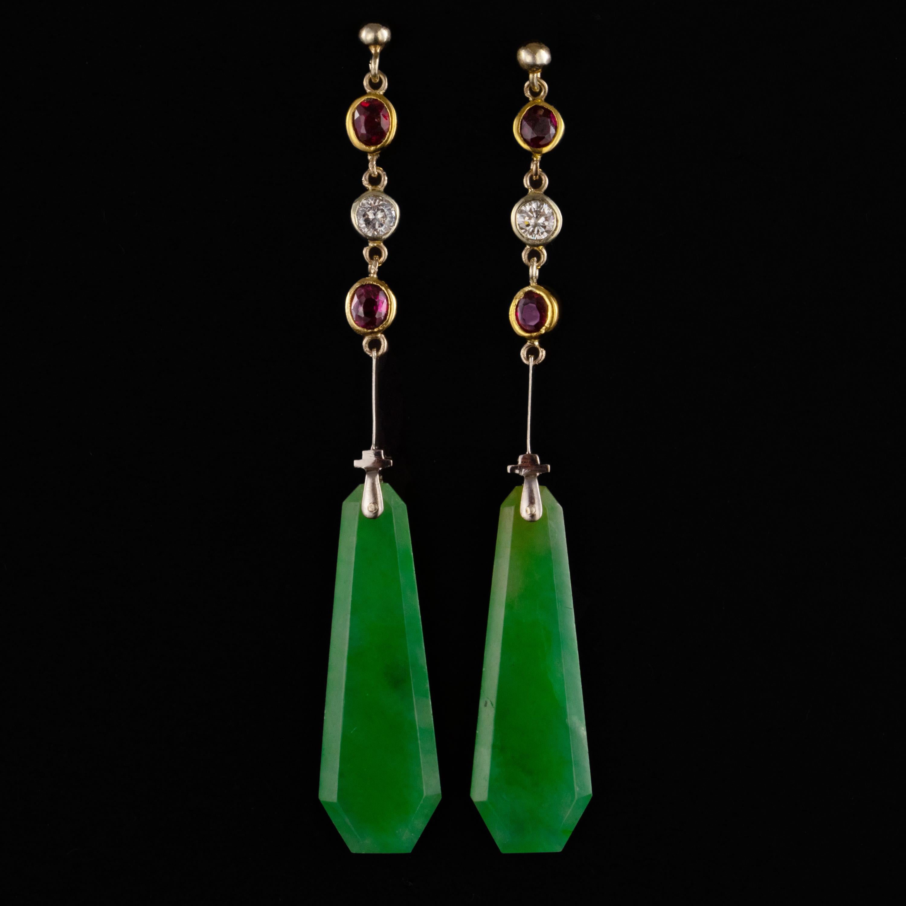 This pair of Art Deco jade, spinel & diamond drop earrings exemplify the very best of sleek, geometric Art Deco design. Entirely hand-crafted in the 1920s from 18K yellow gold and platinum, the earrings measure 66.77mm in length. Each 2.89mm thick
