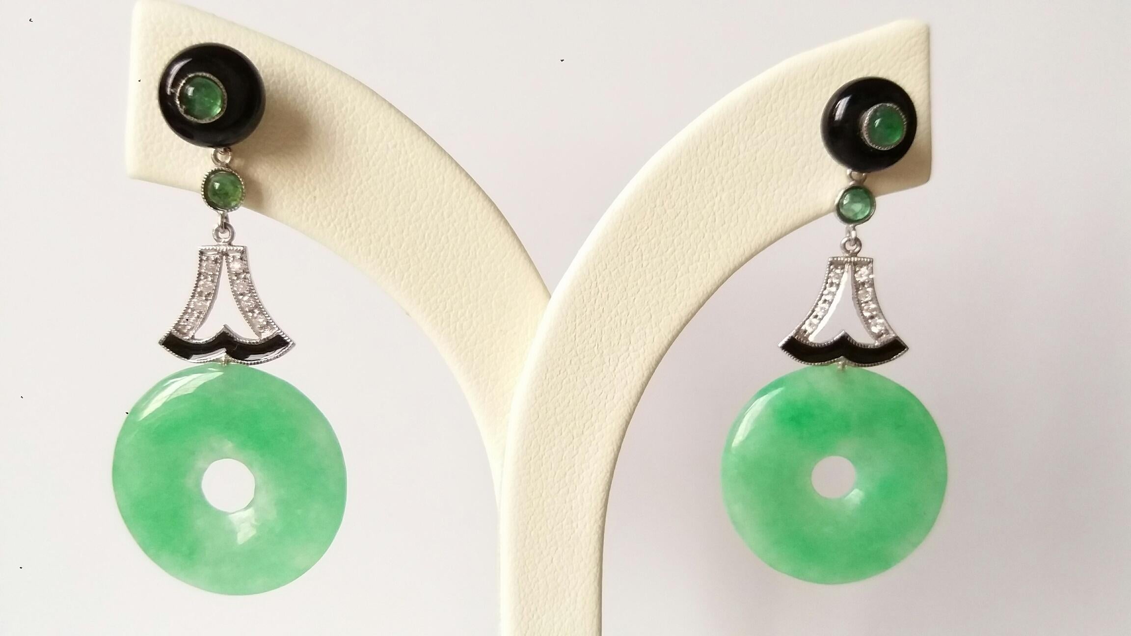 The tops are Black Onix buttons with small round emerald cabs in the center,middle  parts with small round emeralds cabochons , white gold and 16 round full cut diamonds,bottom parts with 2 Burma Jade Donuts
Length 44 mm
Width   22 mm
Weight  7