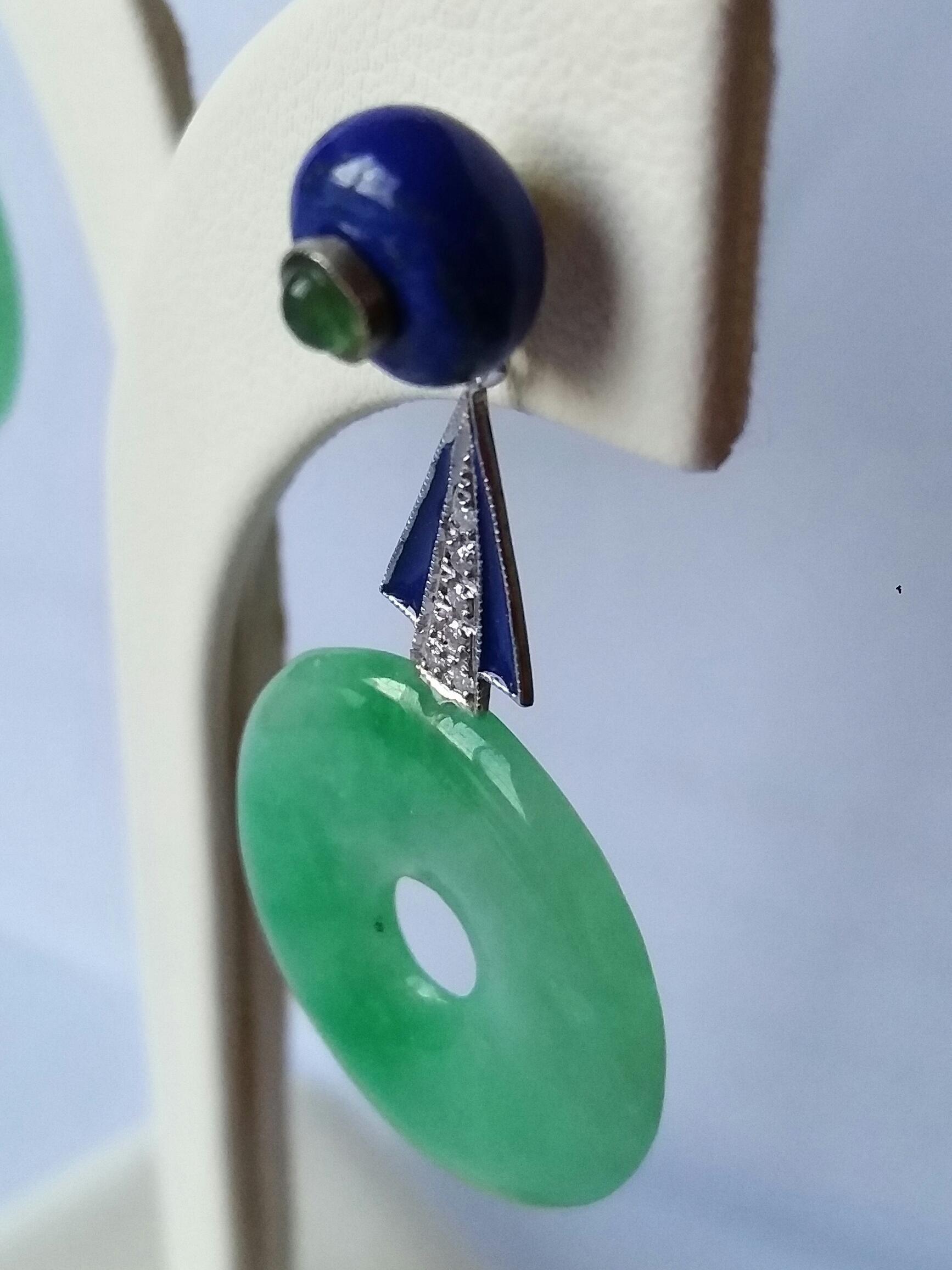 Tops are 2 round Lapis Lazuli buttons with a small round emerald cabochon in the center , middle parts in white gold,small full cut round diamonds and blue enamel , bottom parts are 2 plain Burma Jade donuts. 

In 1978 our workshop started in Italy