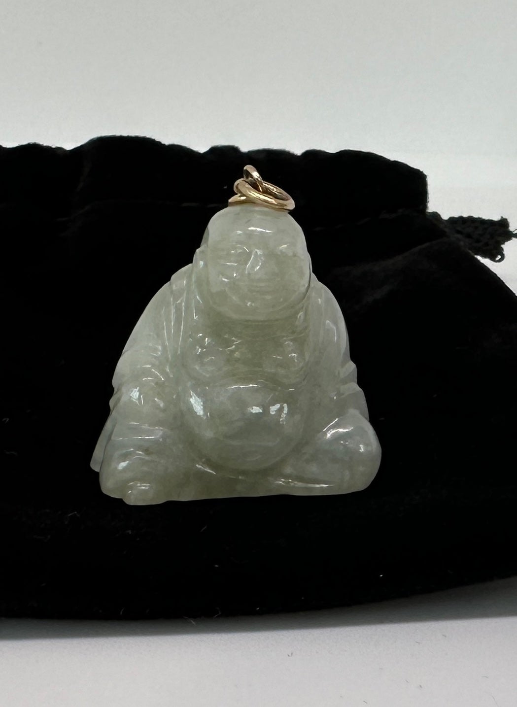 This is a wonderful antique Art Deco Jade Smiling Fat Buddha Pendant in 14 Karat Gold.  The Buddha is exquisitely carved in natural Jade.  The Buddha with his radiant smile and Fat Buddha Belly is also known as the Buddha of Happiness, and the