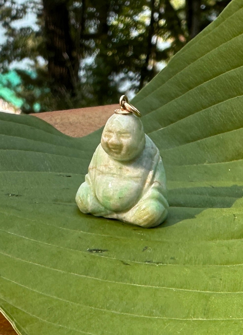 This is a wonderful antique Art Deco Jade Smiling Fat Buddha Pendant in 14 Karat Gold.  The Buddha is exquisitely carved in natural Jade.  The Buddha with his radiant smile and Fat Buddha Belly is also known as the Buddha of Happiness, and the