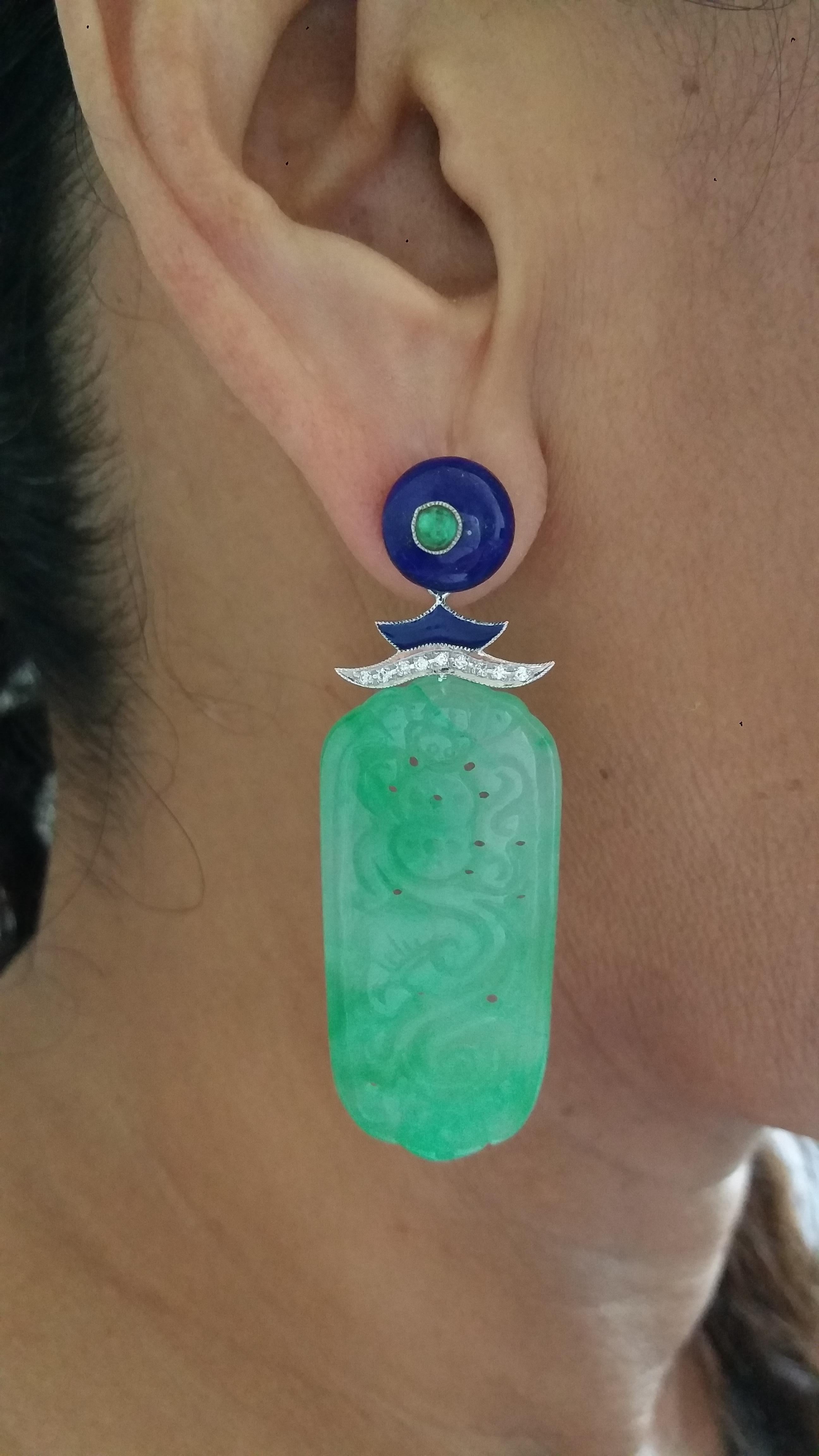 2 Lapis Lazuli  round buttons tops with small emeralds round cabochons  in the center, middle parts in white gold, 2 small emeralds,18 round full cut diamonds,blue enamel ,bottom parts are 2 carved Burma Jade 
Length 57 mm
Width 19 mm
Weight 15