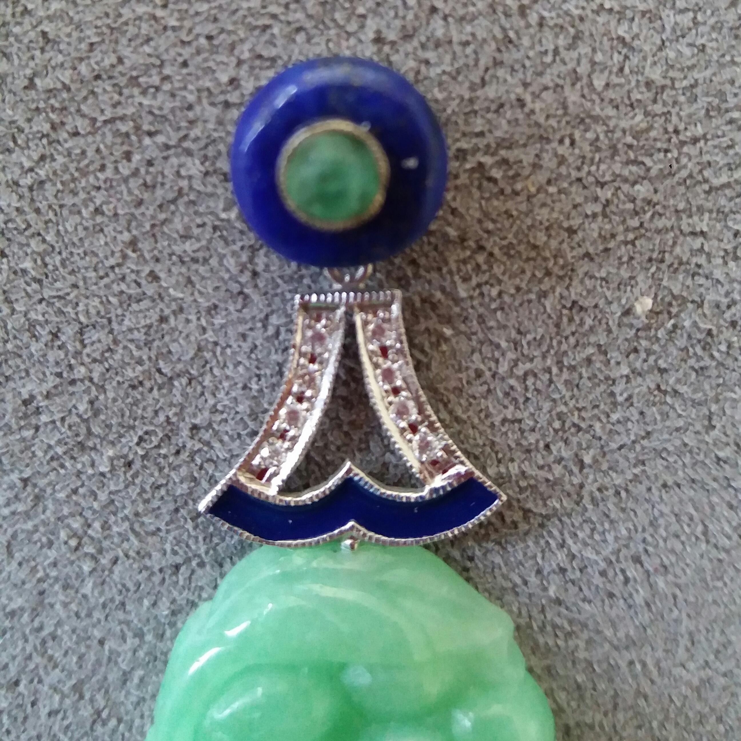 Tops are 2 round Lapis Lazuli buttons with a small round emerald cabochon in the center , middle parts in white gold,small full cut round diamonds  and blue enamel , bottom parts are 2  Burma Jades carved in floreal patters.
In 1978 our workshop