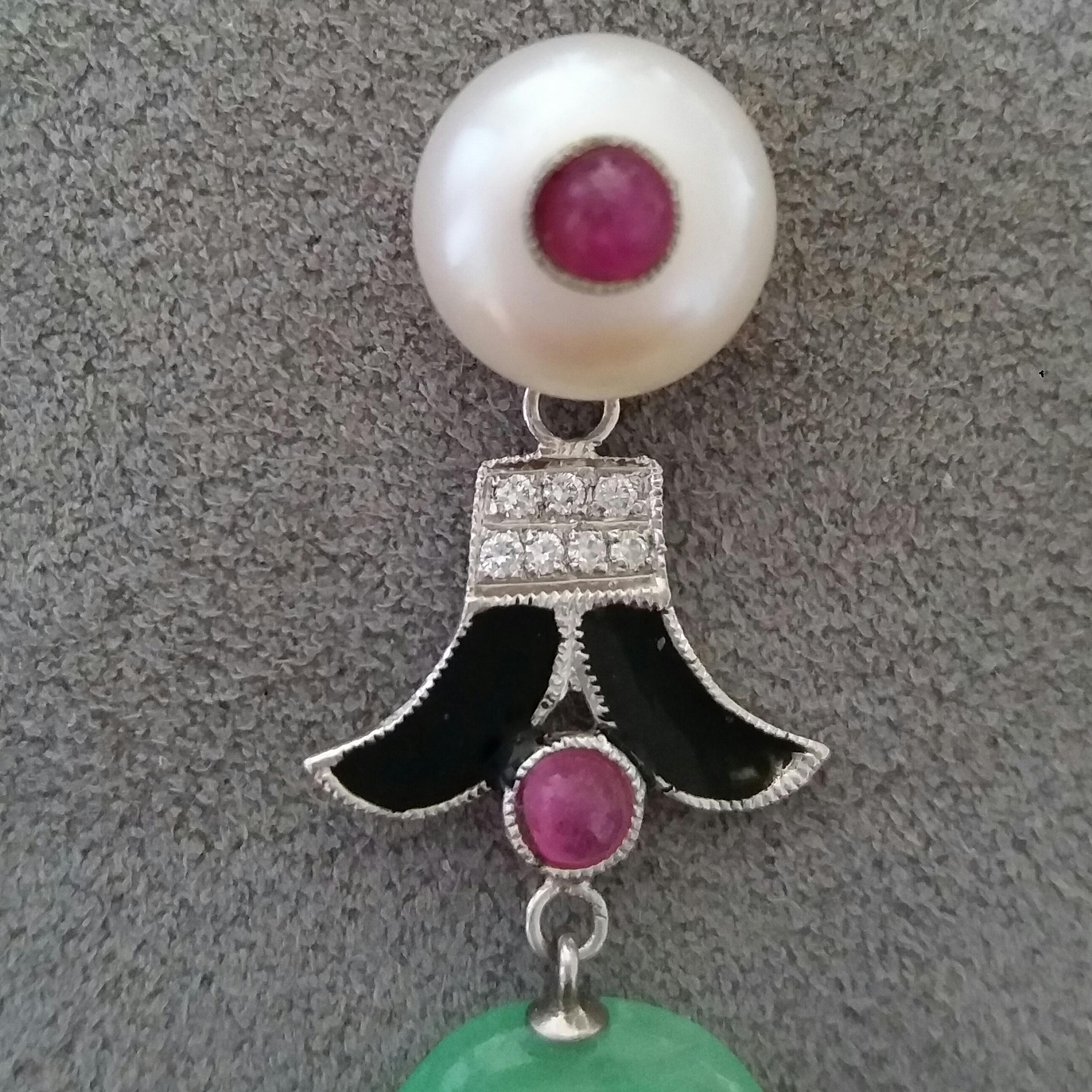 Art Deco earrings with 2 fresh water pearls and round rubies cabochon in the center, middle parts in white gold, full cut round diamonds,small rubies,black enamels,bottom parts have 2 oval shape carved Burma Jades.

In 1978 our workshop started in