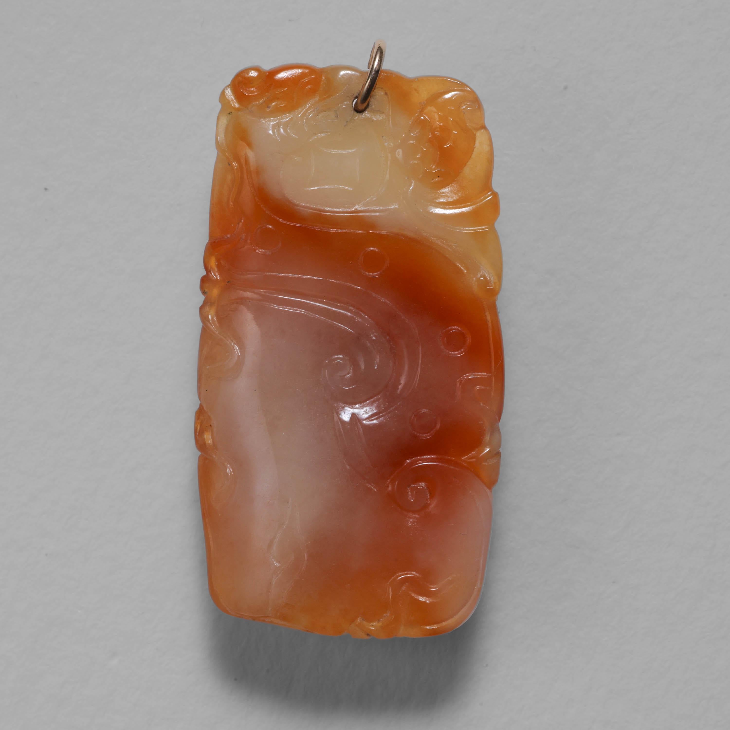 This astonishing Art Deco (circa 1930) jade pendant is the color of homemade caramel. In fact, it's the color of the caramel just after you have melted the sugar to a golden syrup and are stirring in the thick, sweet cream. Hand-carved around 1920