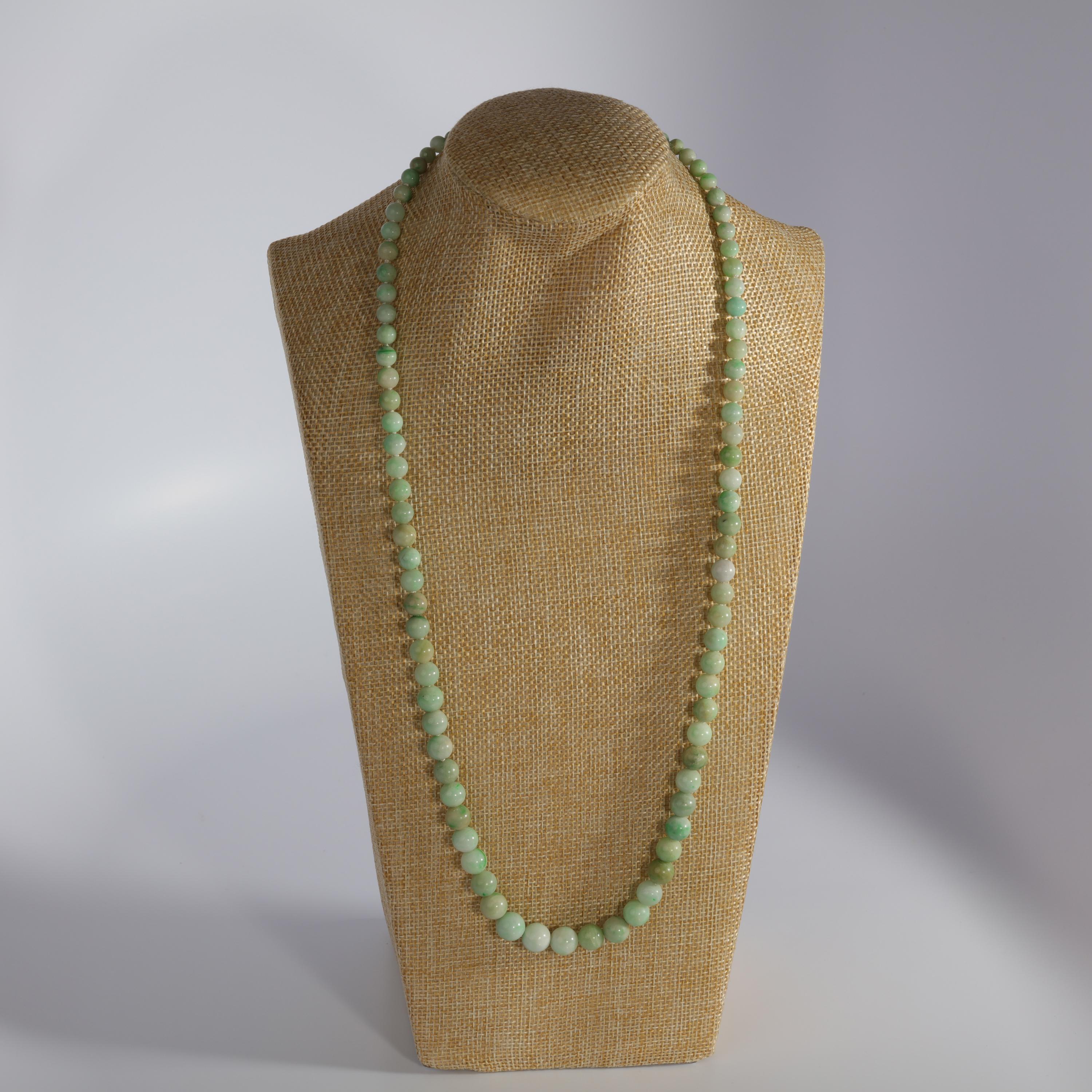 This strand of 89 hand-carved jadeite jade beads is quite rare because these jade beads are imperfect: look at that one: a soft mint-green with the tiniest patch of oxidized iron; or this one here with a natural fissure that's ever so slightly