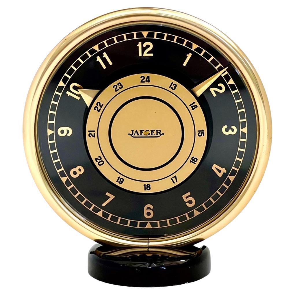 Horloge de cheminée de huit jours Art Déco Jaeger LeCoultre en laiton doré et verre noir