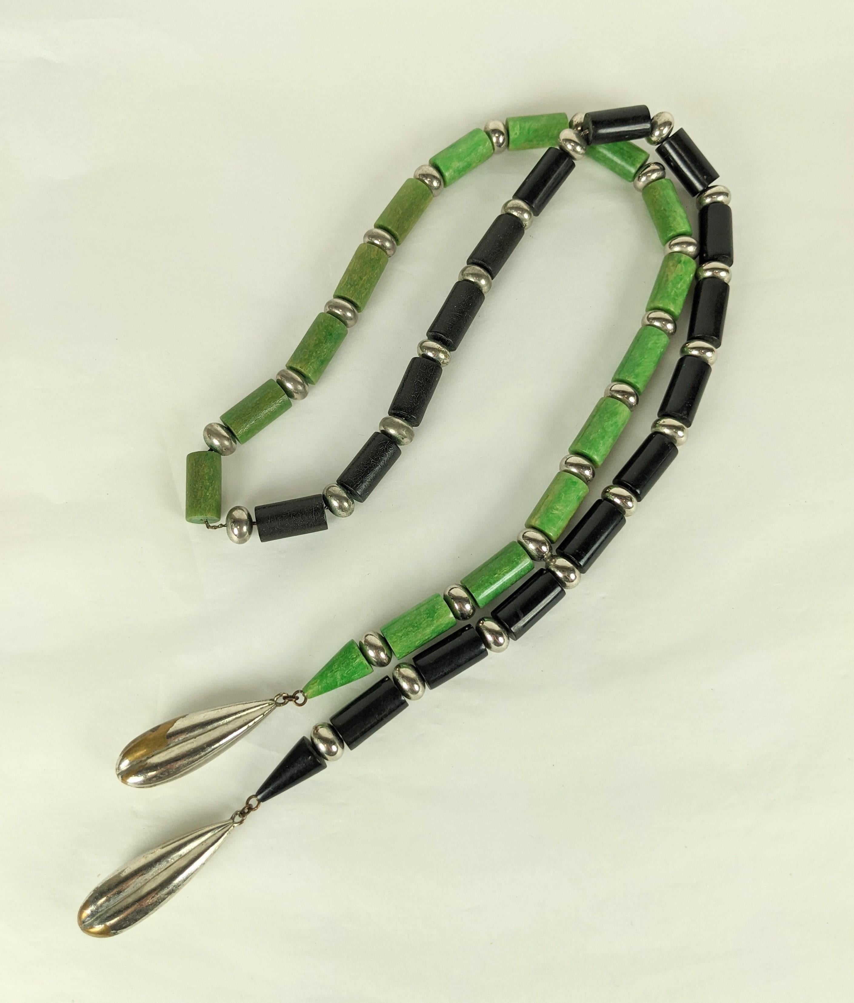 Striking Art Deco Jacob Bengel Bakelite Sautoir of jade and black bakelite toggle beads with chrome plated spacers ending in 2 fluted metal chrome drops (some losses on chrome plating on drops). 
Total 40