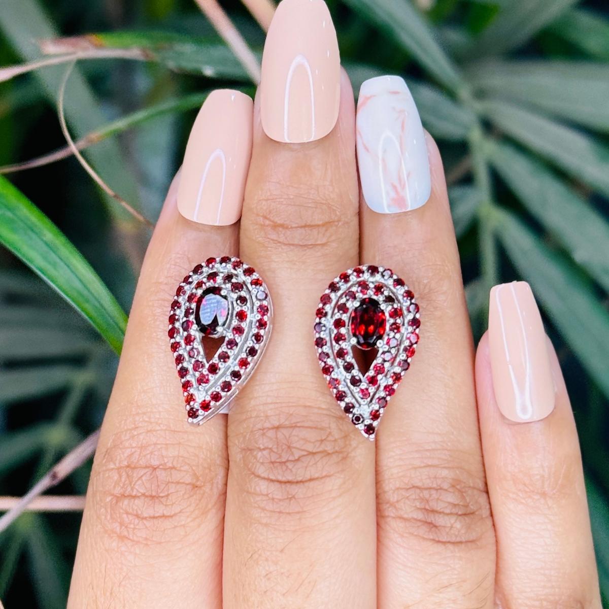 Art Deco Style January Birthstone Garnet Stud Silver Earrings in sterling silver to make a statement with your look. You shall need stud earrings to make a statement with your look. These earrings create a sparkling, luxurious look featuring, oval,