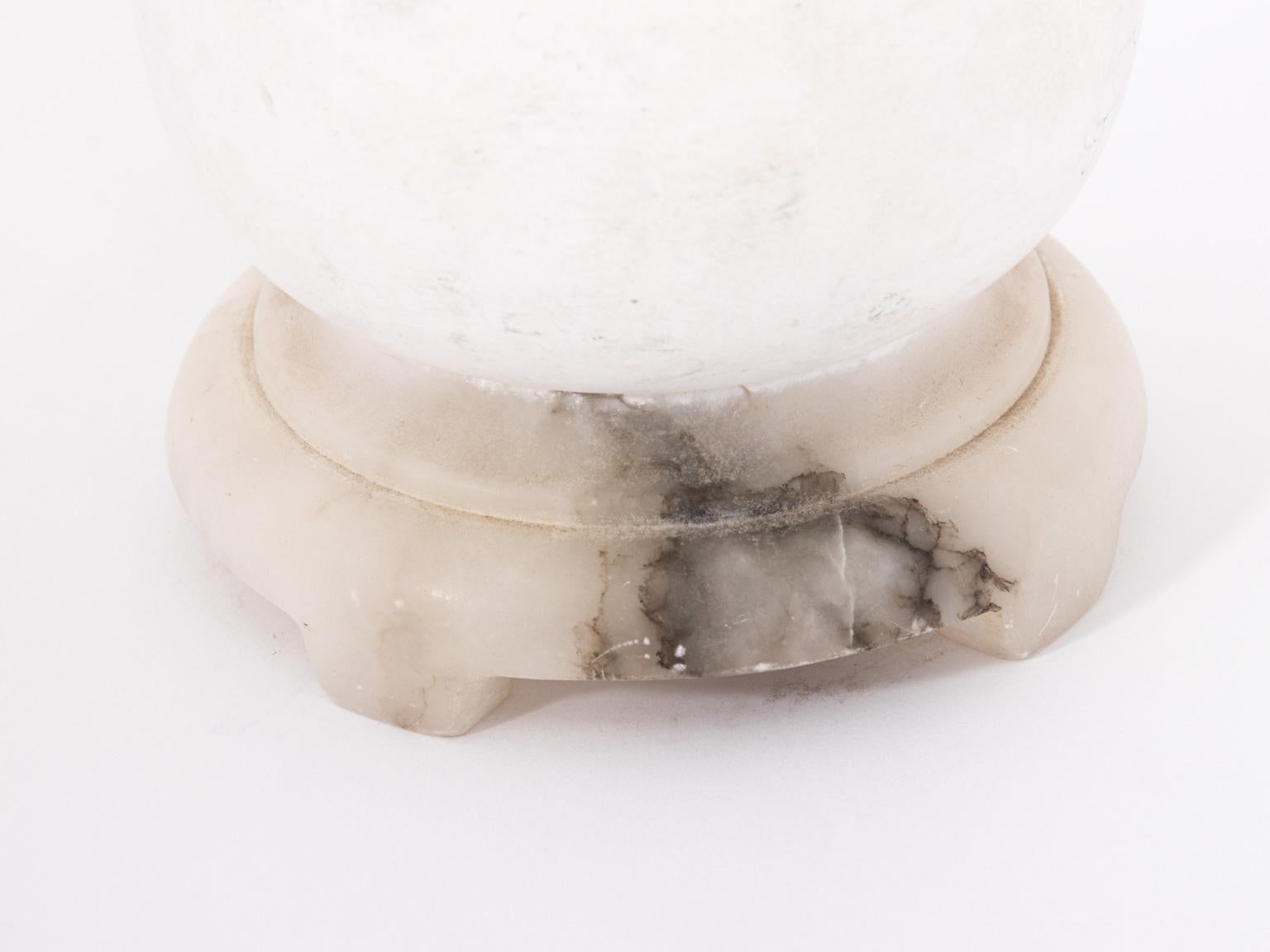 Art Deco style Pixie lamp on a white Alabaster base by JB Hirsch Gerdago, circa early 20th century. The piece is in functioning condition with a weight of 52.50 Ounces. Made in the United States. Please note of wear consistent with age and daily use