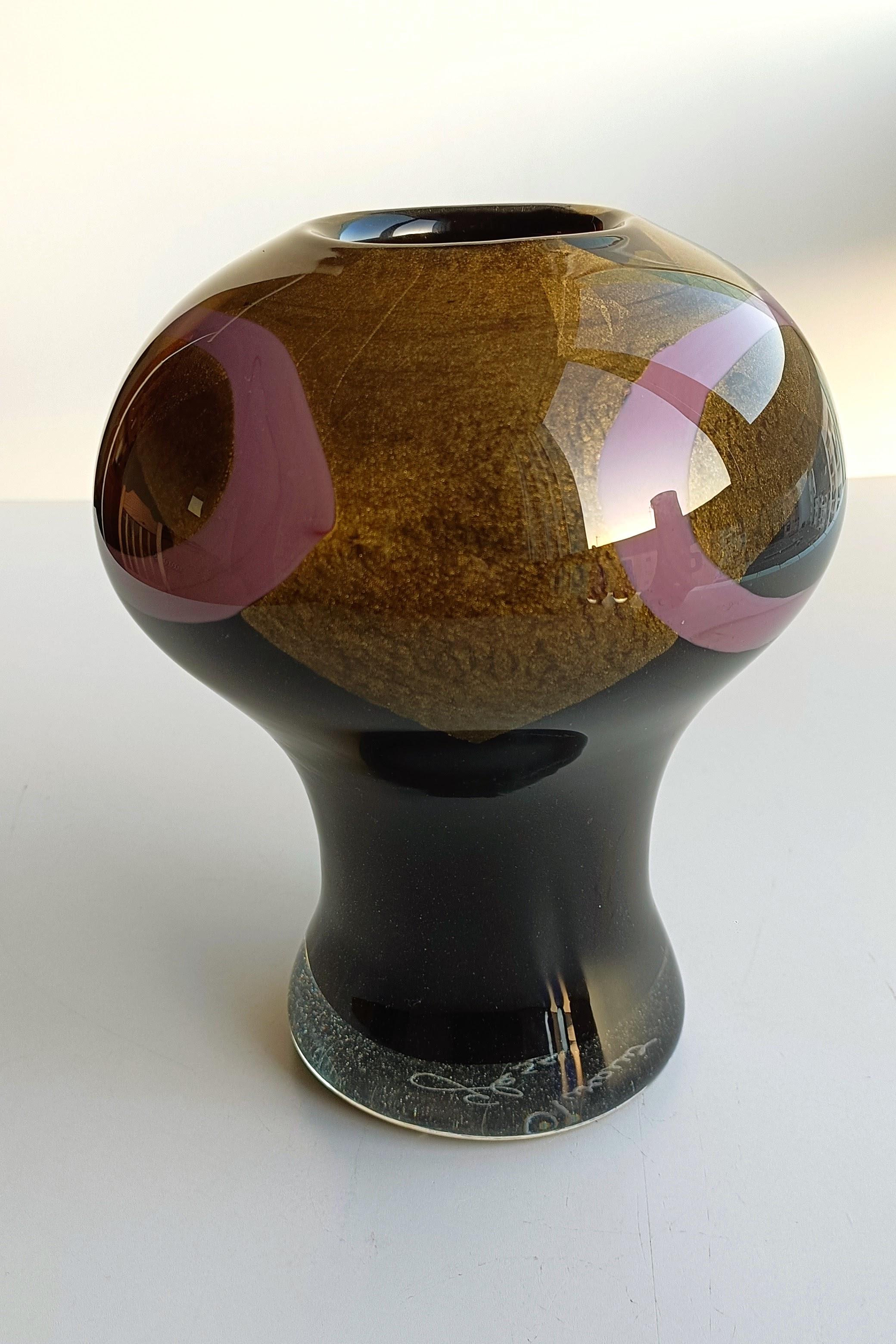 Elevate your décor with this mesmerizing hand-blown Murano glass vase, a radiant homage to the Art Deco era's sophistication. Crafted with meticulous precision, this vase captures the essence of luxury and artistic innovation that defines the Art
