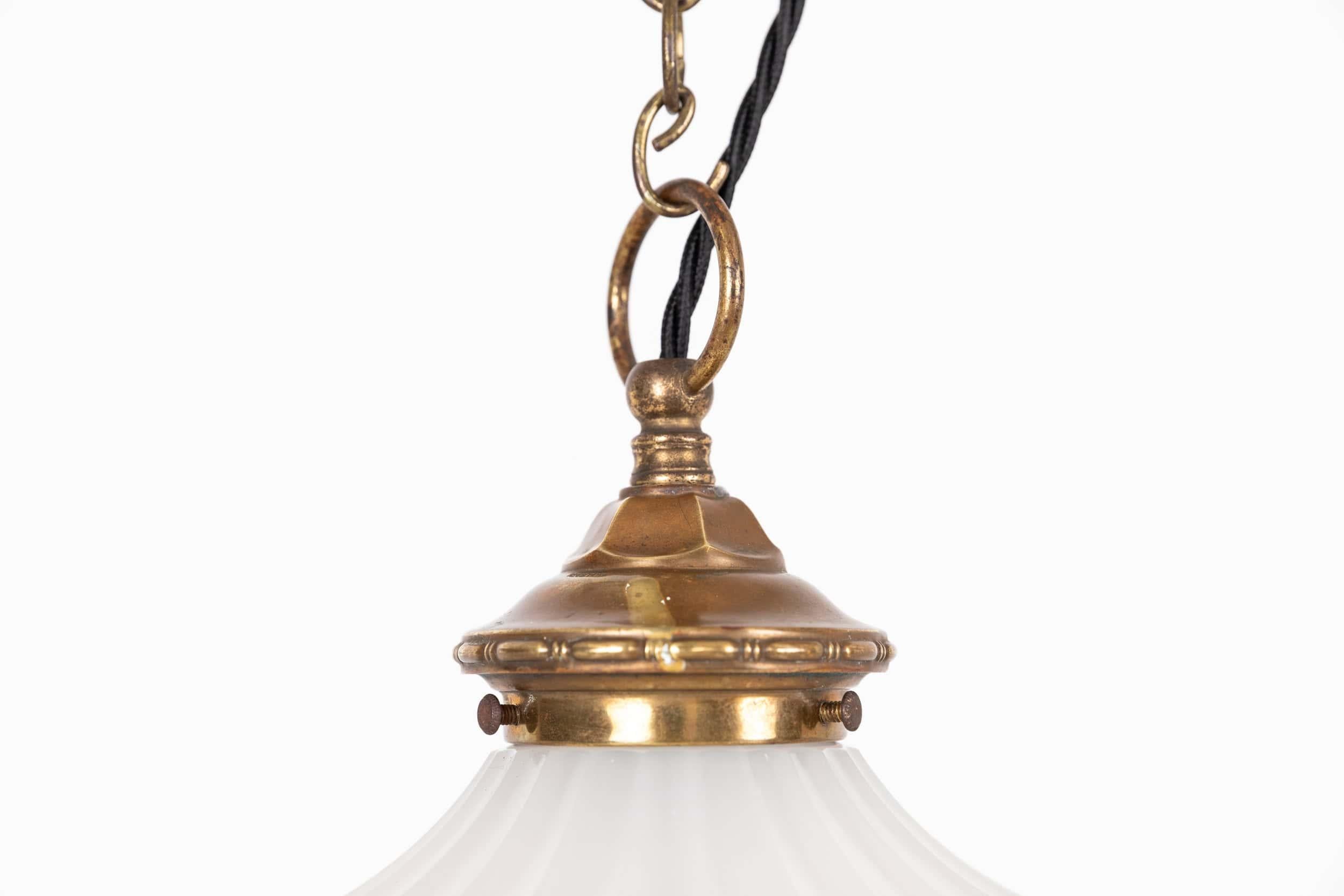 

An incredibly elegant Moonstone 'Doriclite' opaline pendant light. c.1930

A scarcely seen two-part design, thick pressed moonstone glass shade of fluted design with matching bowl and brass gallery.
