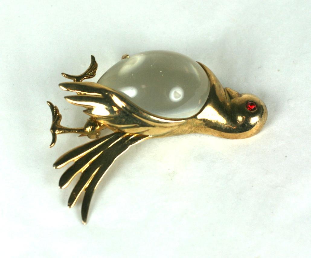 Art Deco Jelly Belly Pigeon Brooch from the 1940's. Puffy chested pigeon strutting confidently with ruby paste eye. Lucite belly set in sterling with gold wash. Excellent condition. 
2.25