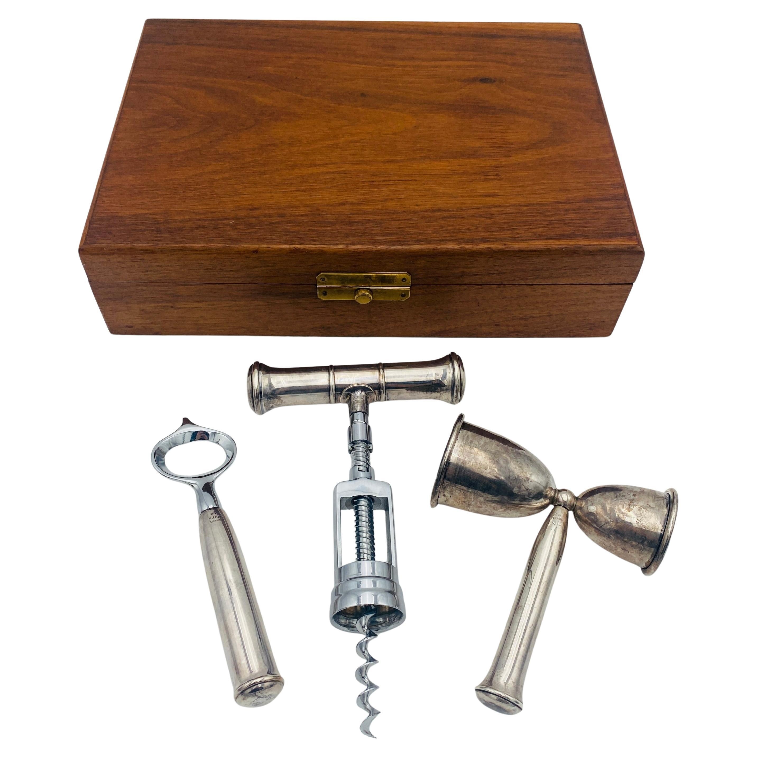 Elevate your mixology experience with this exquisite Art Deco Sterling Bar Tool Set, a captivating ensemble meticulously crafted by the renowned American silversmith John Hasselbring of Brooklyn, New York, in the early 20th century. This