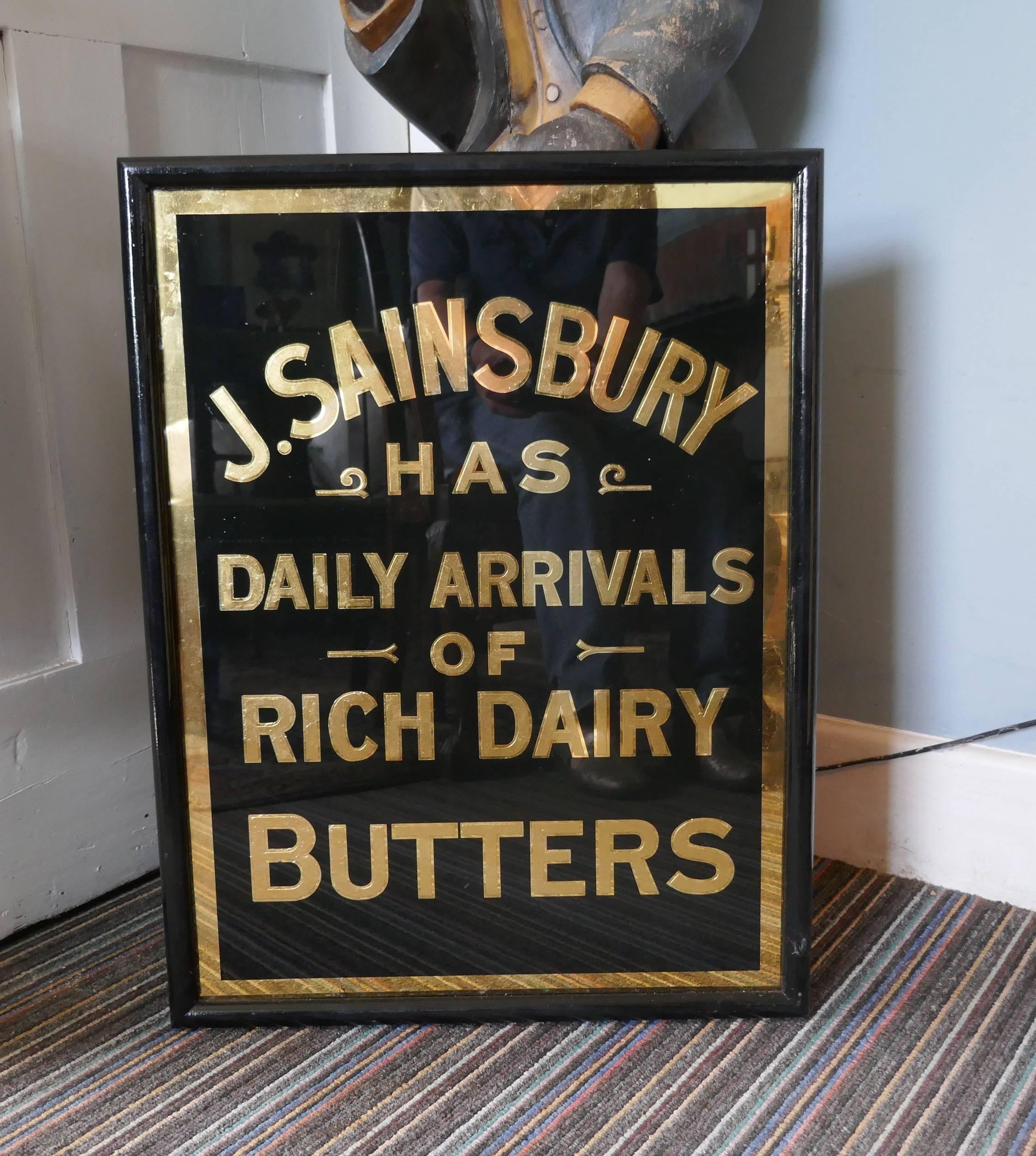 Art Deco J.S.Sainsbury’s butter advertising mirror sign, in black and gold

A great piece, the glass is all original and unrestored and it has been set in a well chosen black wooden frame
The sign tells us that J.S.Sainsbury has daily arrivals of
