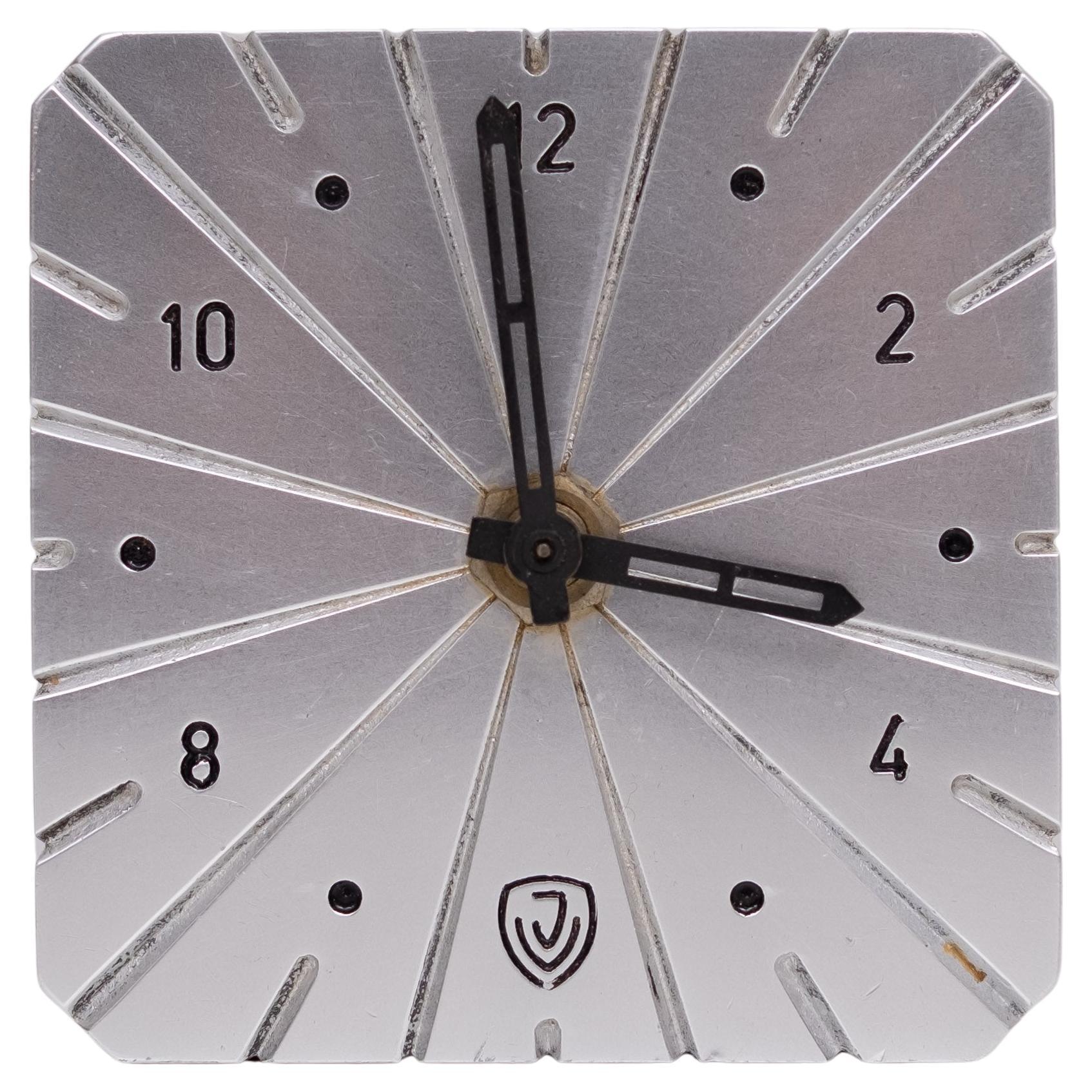 Very nice attractive Art Deco Table Clock . Solid Aluminum. 
comes with a wind up clock mechanism. Works very good .   