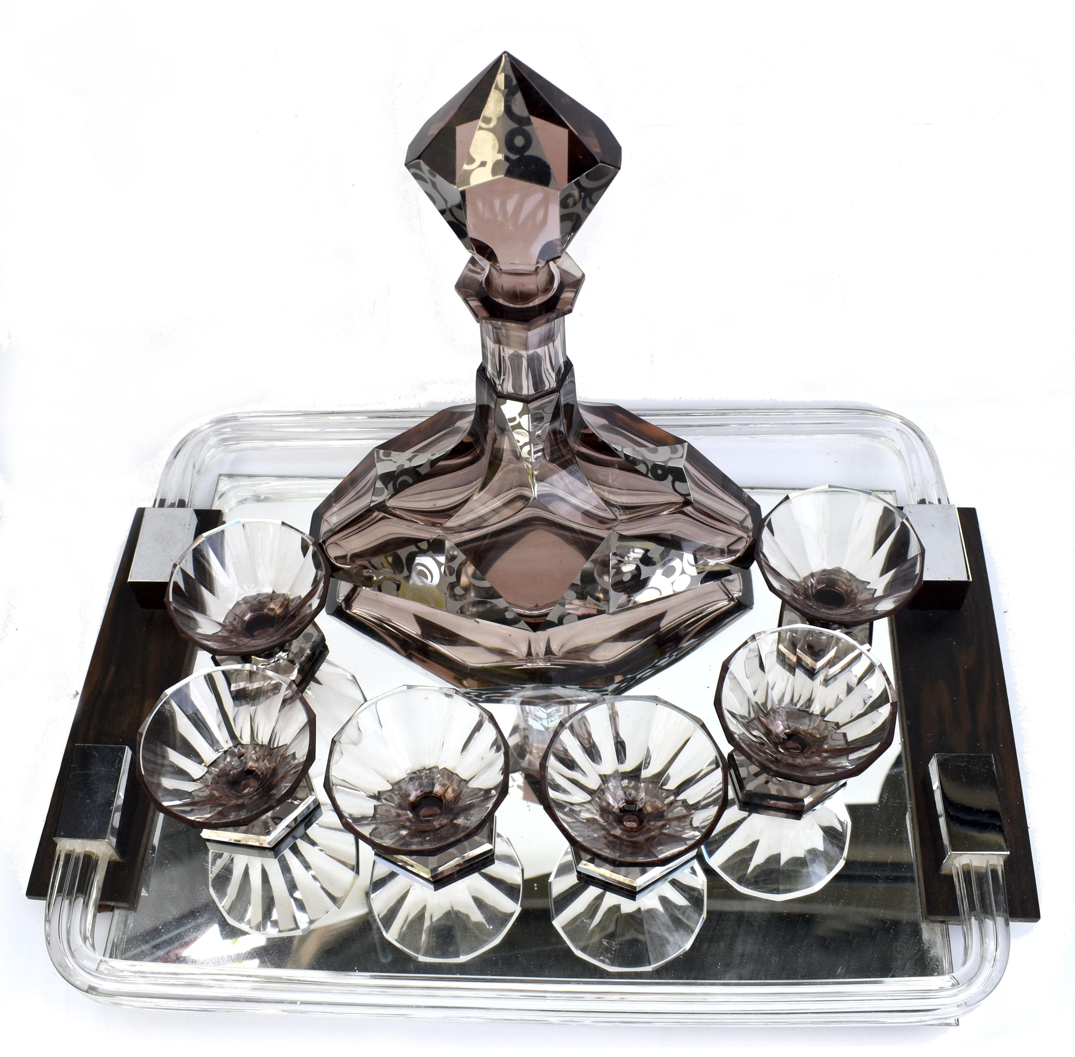 Very high quality and striking looking 1930's Art Deco Czech glass decanter set. Features a angular shape decanter with stopper and six good sized conical shaped glasses , perfect for modern use. The whole set is in olive green glass which has