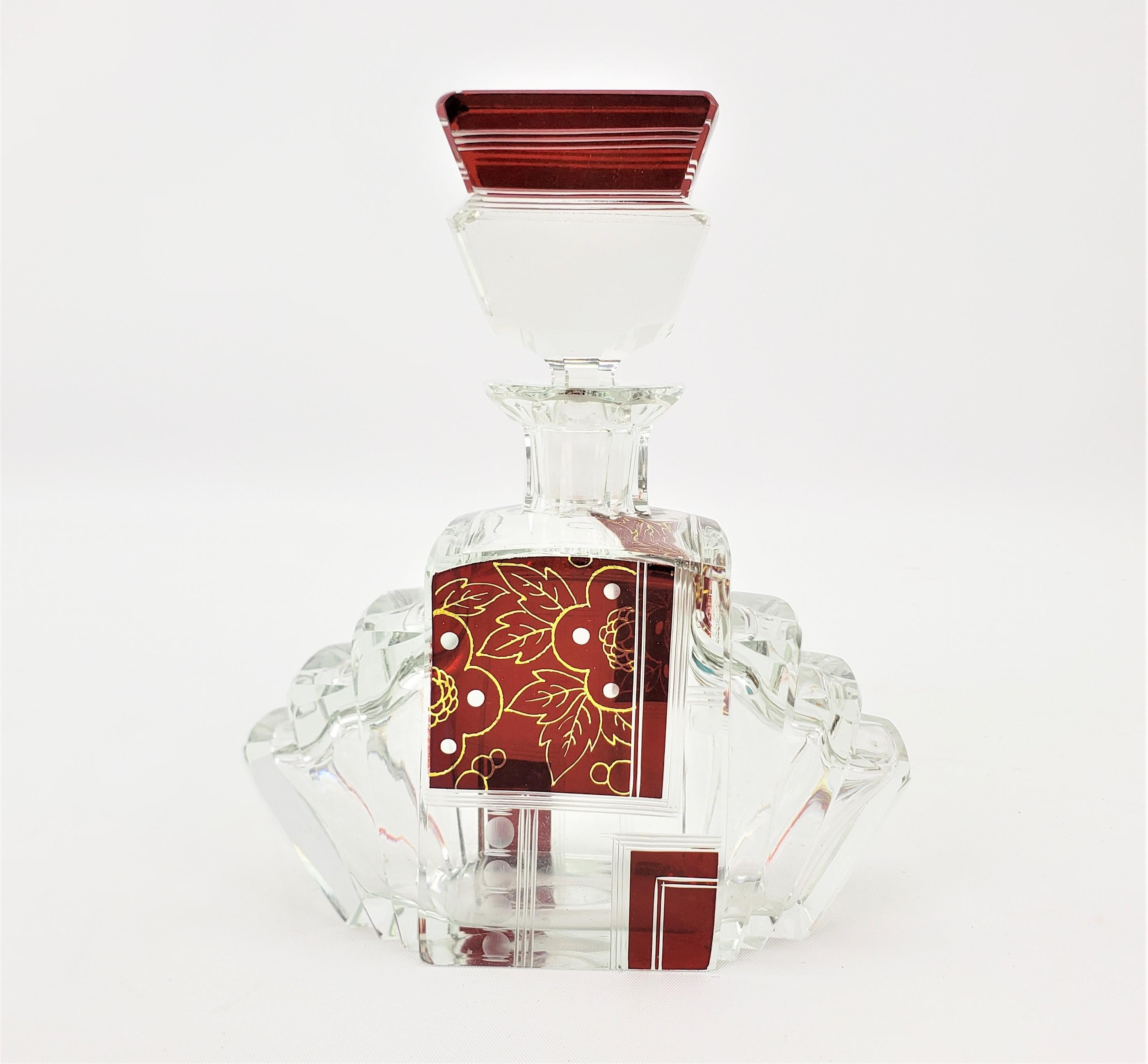 This very nicely executed stepped Art Deco perfume bottle is unsigned, but done in the style consistent with that of Karl Palda of the now Czech Republic, and dating to the 1930's. The stylized triangular shape of the bottle has stepped sides, with