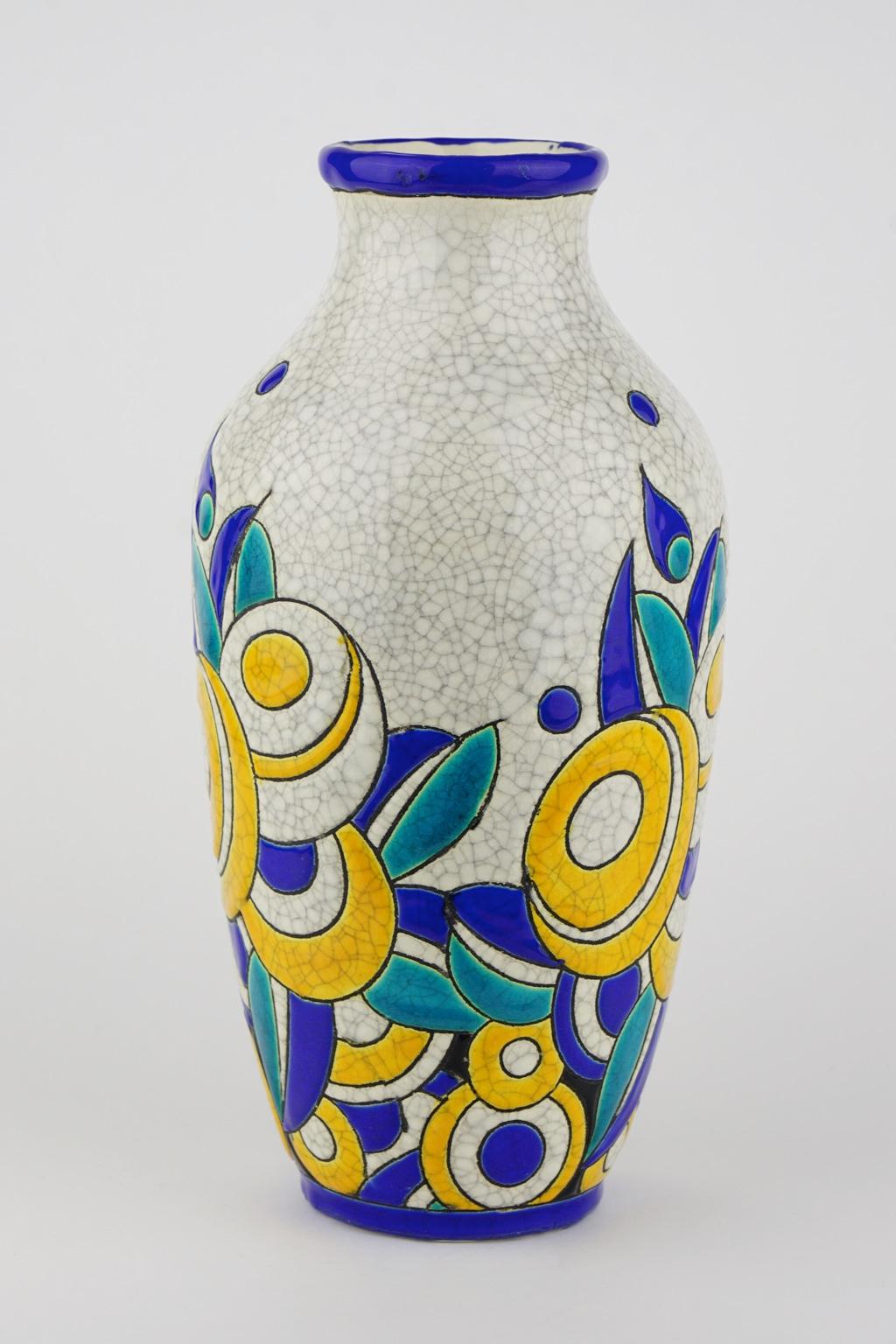 Art Deco Keramis Boch crackled enameled earthenware vase with geometric flower pattern. Marks D1175 and F806. Size: H. 27.6 cm. Top diameter 7.3 cm bottom diameter 8 cm.