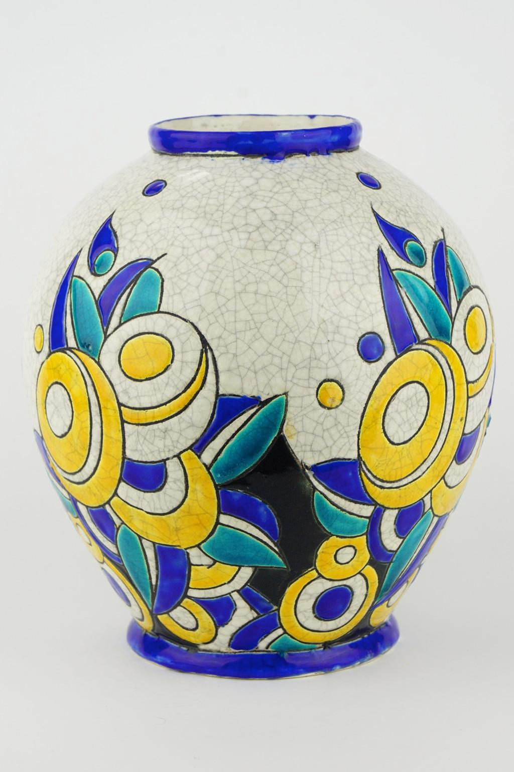 Art Deco Keramis Boch crackled enameled earthenware vase with geometric flower pattern. F894 (probably). Mark D1175. 

Size: Height 23 cm. Top diameter 9 cm bottom diameter 12 cm.