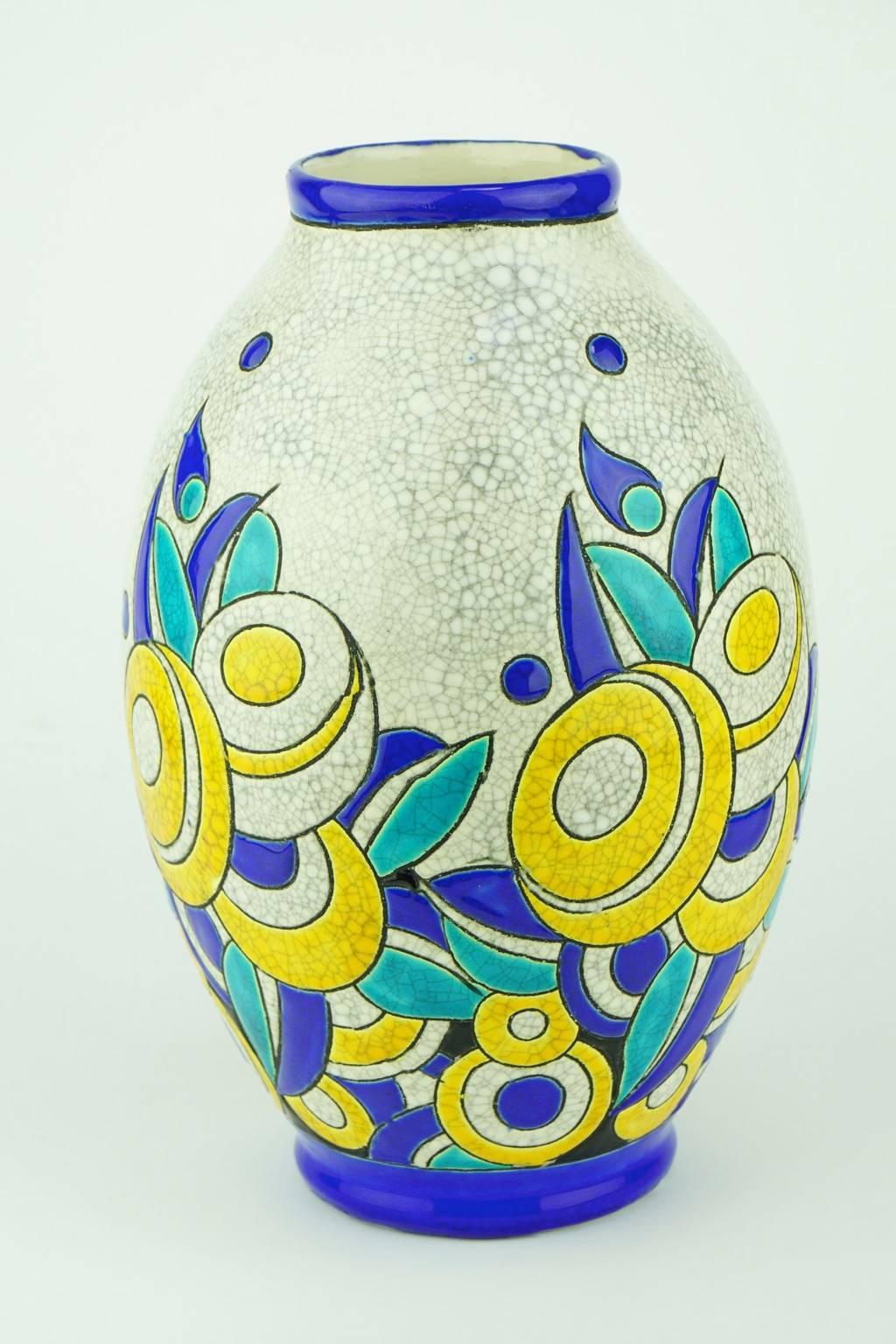 Art Deco Keramis Boch crackled enameled earthenware vase with geometric flower pattern. Marks D1175 and F899. Size: H. 26.8 cm. Top diameter 8.1 cm bottom diameter 9.5 cm.