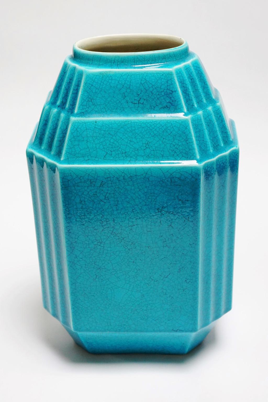 An Art Deco Keramis Boch geometric crackled monochrome turquoise vase by Charles Catteau. F 1050. 

Marks: Boch Freres.

Measure: Diameter top 9 cm, diameter base 12 cm, height 30 cm.