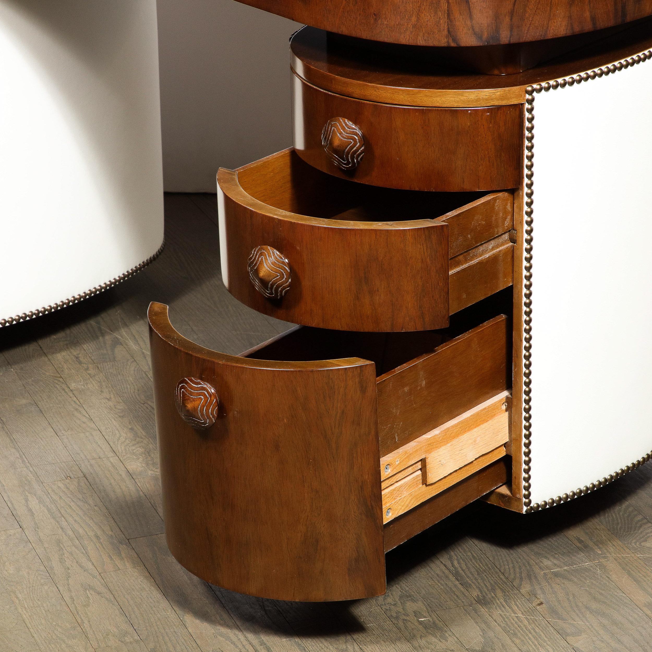 Mid-20th Century Art Deco Kidney Paldao Wood w/ Leather Brass Studded Base Desk by Gilbert Rhode