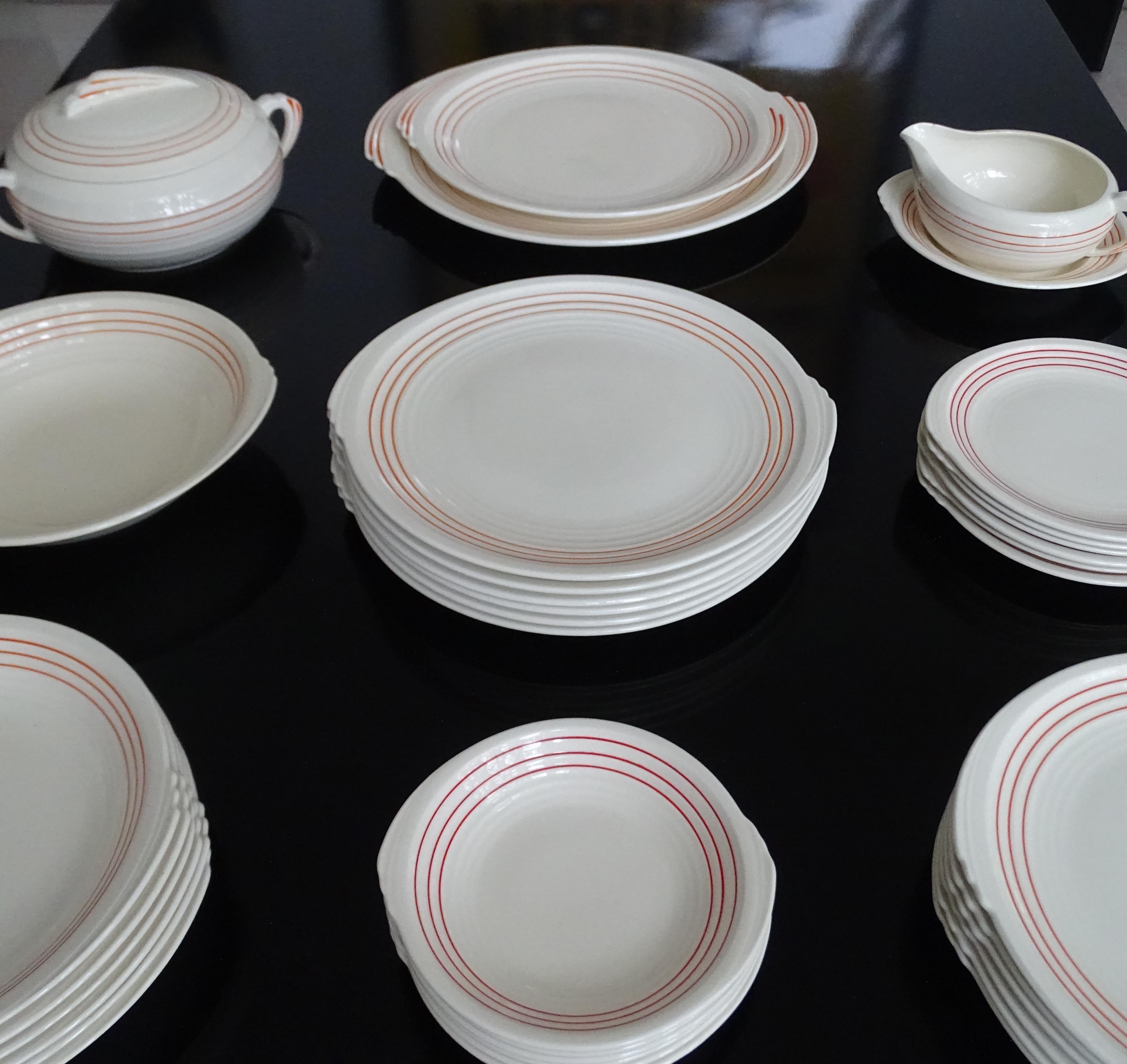 Extremely rare Art Deco modernist porcelain china dining tableware set manufactured by Edwin Knowles during the 1930s, this set was the first introduced in 1936 with a typical Art Deco streamlined design, which is especially remarkable with the