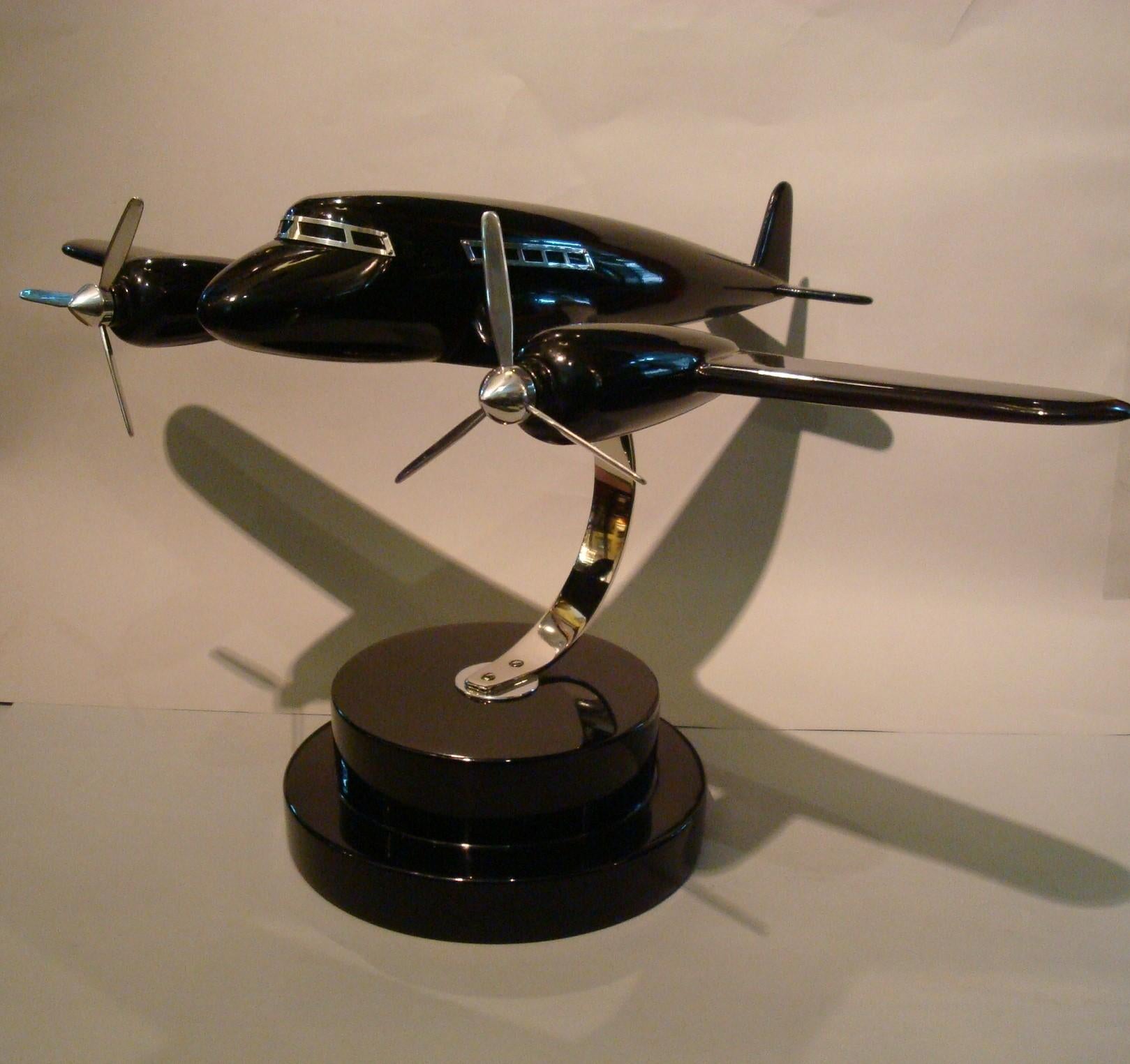 Art Deco lacquer wood airplane model, France, 1930s.
Very nice and rare airplane model, made of lacquered wood and chrome windows and propellers.. Very good restored conditions.