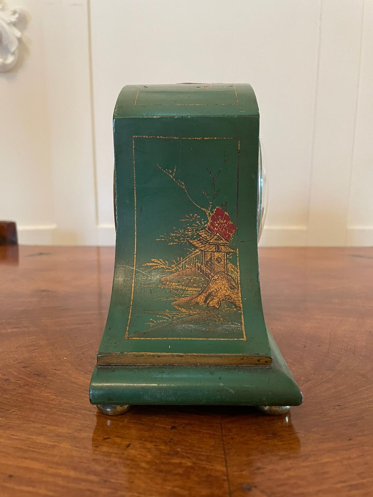 Art Deco lacquered Chinoiserie mantel clock having an attractive green lacquered chinoiserie shaped case with an eight day French movement, brass bezel, porcelain dial and original hands.

A charming example in original condition and in good