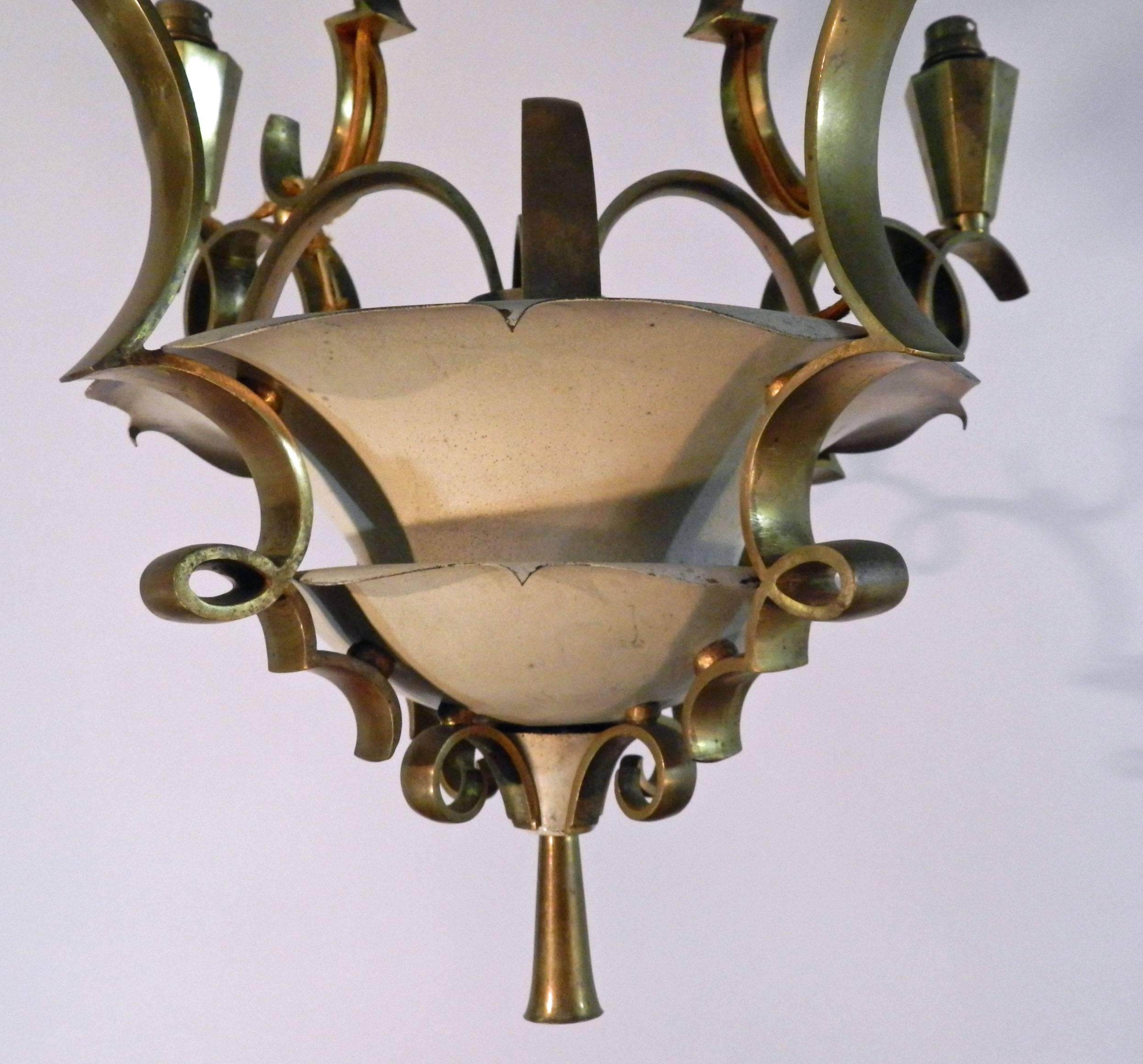 Art Deco lacquered metal and gilt bronze chandelier in the style of Jules Leleu,
circa 1930.