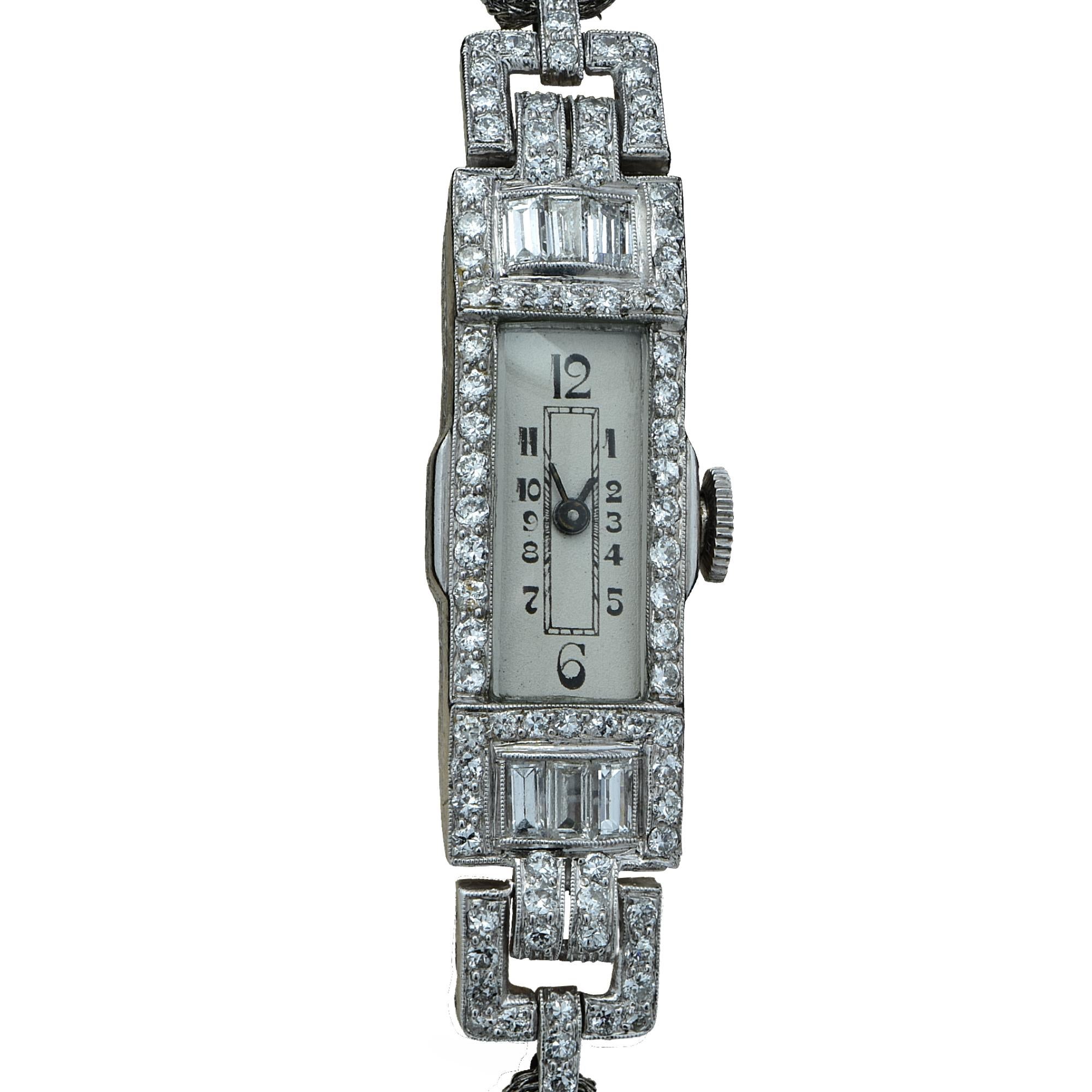 Stunning elegant Art Deco manual wind diamond wrist watch featuring 69 mixed cut diamonds weighing approximately 2 carats, G Color, VS- SI clarity. The watch measures 12.6mm wide and measures 6.5 inches in length. 

Our pieces are all accompanied by