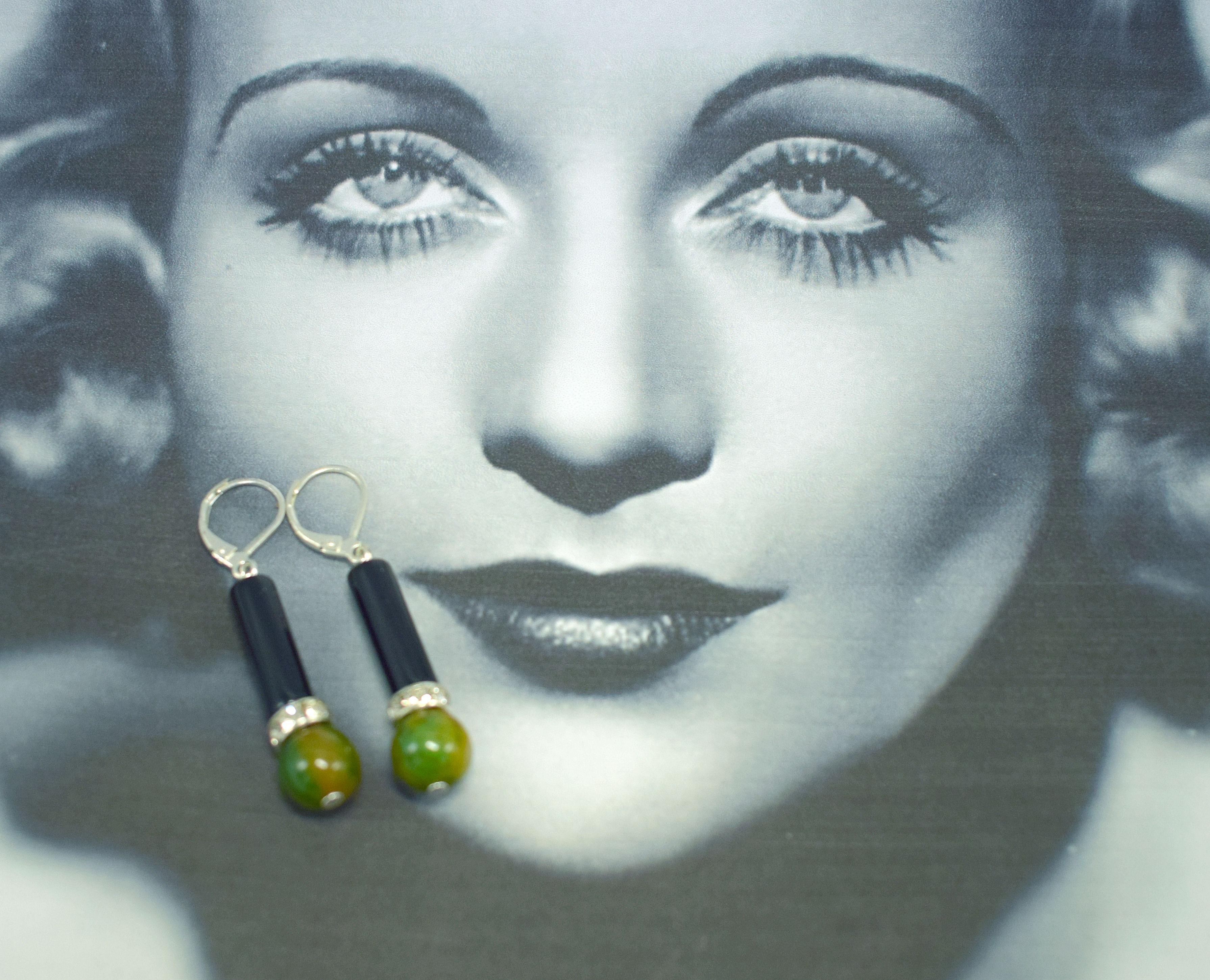 Stylish 1930's Art Deco bakelite pair of  earrings in a lovely marbled green & yellow ‘end of day’ phenolic bakelite with black Lucite and circle of diamante stones. Silver plated lever back for pierced ears which are replacements to the originals