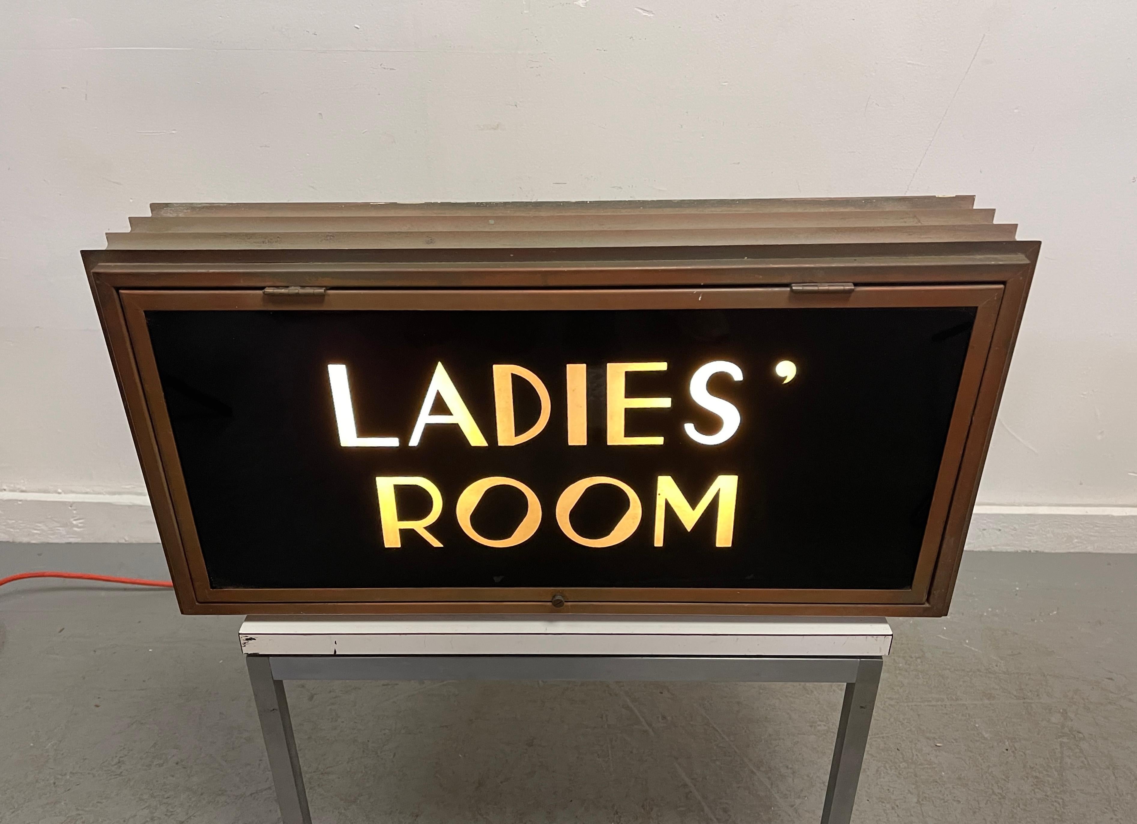Seldom seen Art Deco bronze and glass light up sign salvaged from an 