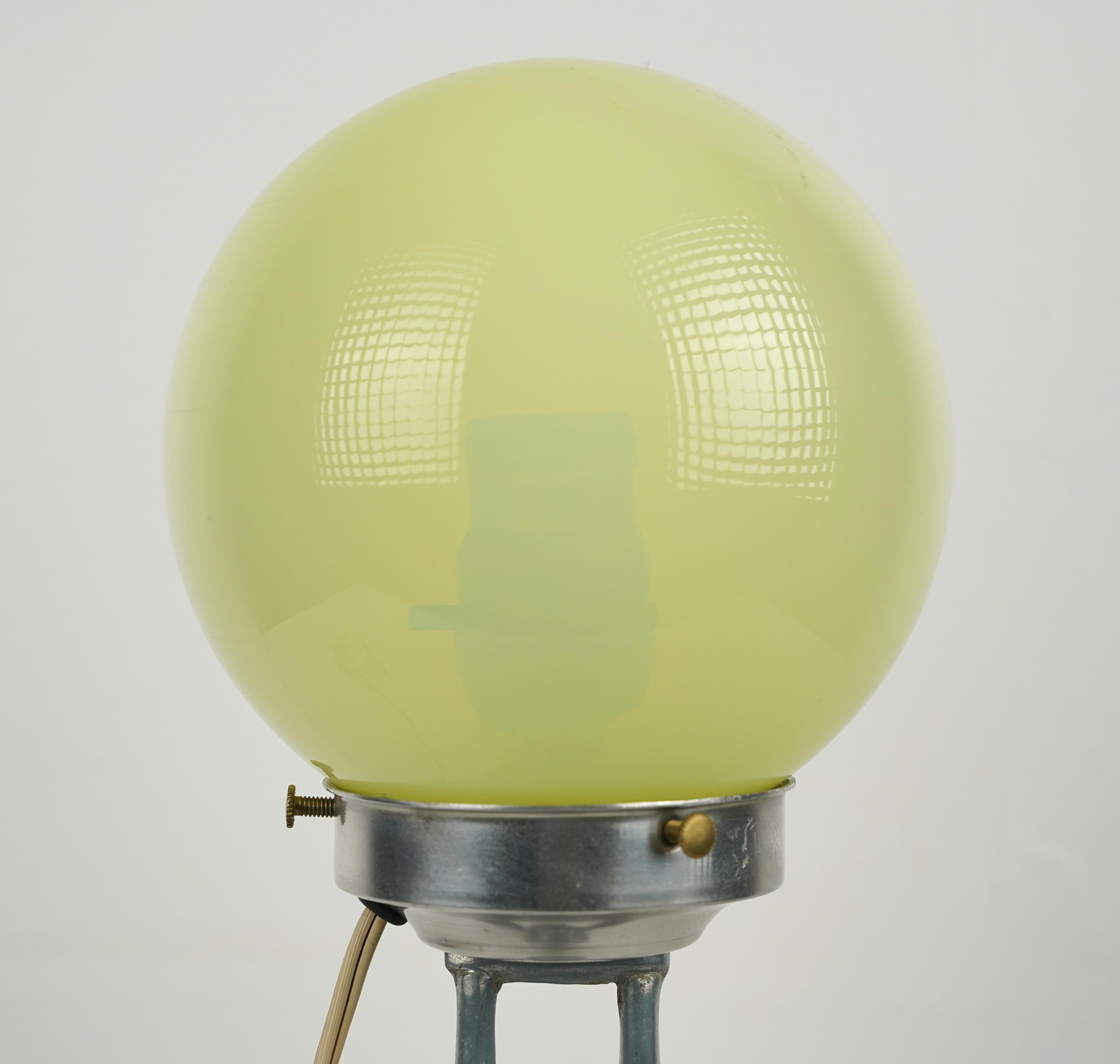 Art Deco style table lamp featuring an aluminum figure of a woman base, often referred to as 
