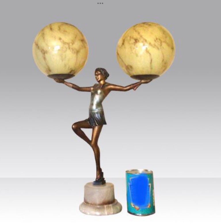 French Art Deco Lady Lamp Holding Aloft a Pair of Marbled Globes For Sale