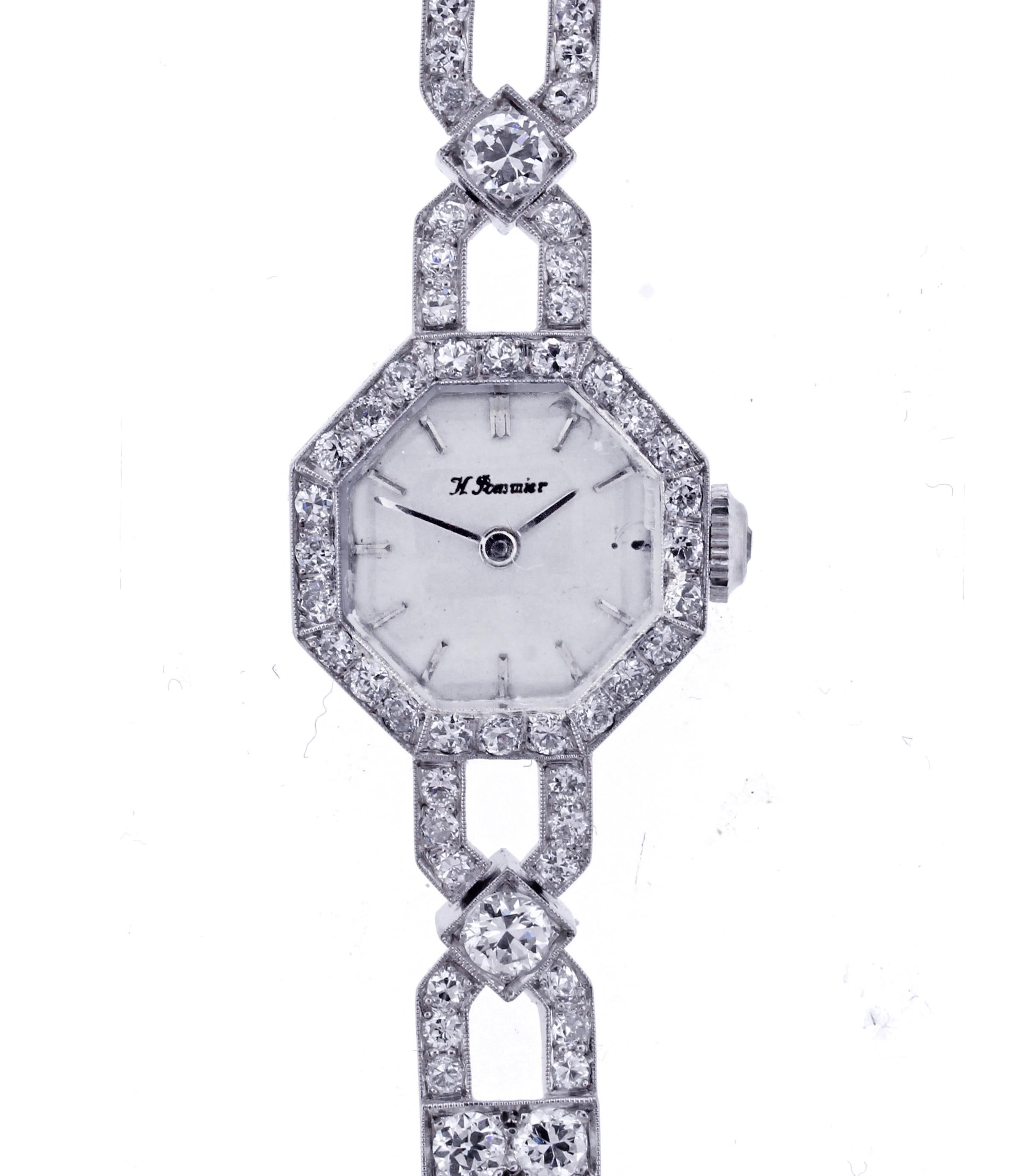  Art Deco lady's bracelet watch featuring a total of 4.35 carats of diamonds. The octagonal dial as well as the unusual link bracelet are completely set in Old European cut diamonds. Twenty-five larger diamonds at the intersection of each link have