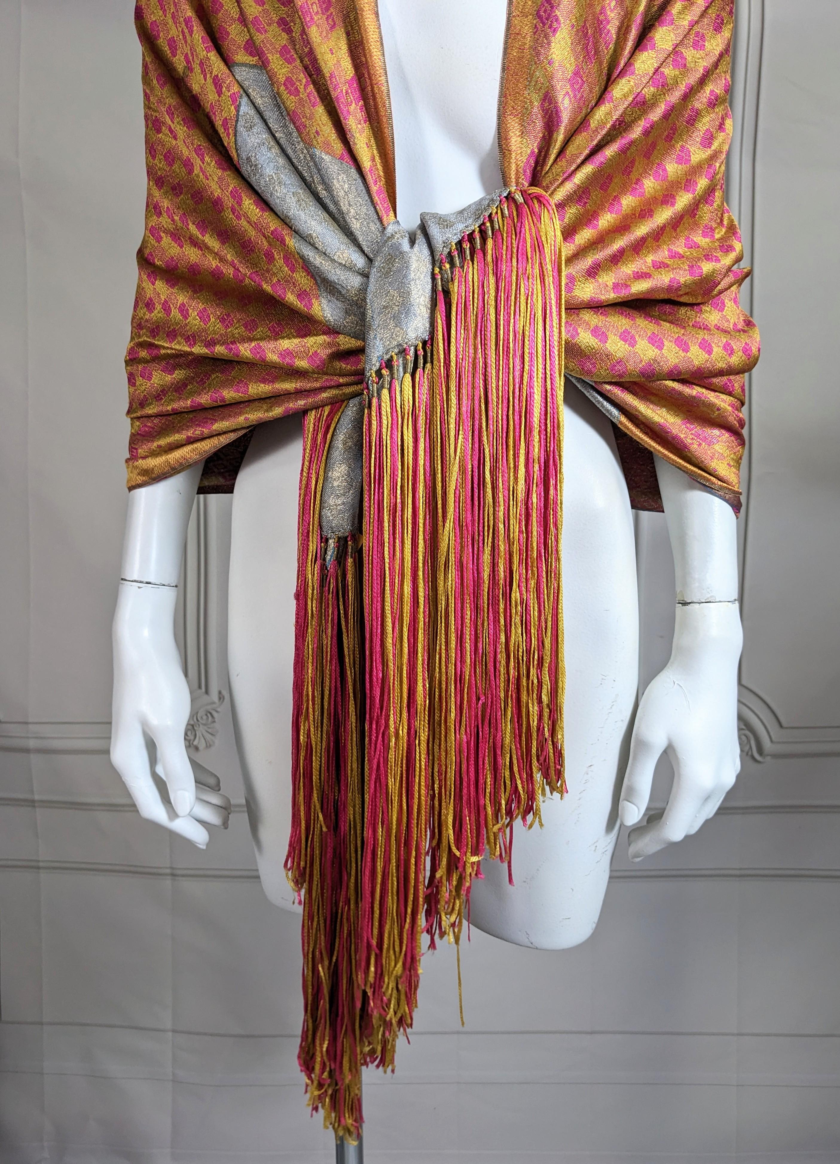 Lovely Art Deco Lame Orientalist Motif Shawl from the 1920's. In tones of rasberry, yellow, orange, gold and silver gilt turquoise with long silk knitted fringe in fuschia and gold silk. Gold and silver patinaed metallic overtones throughout. 30