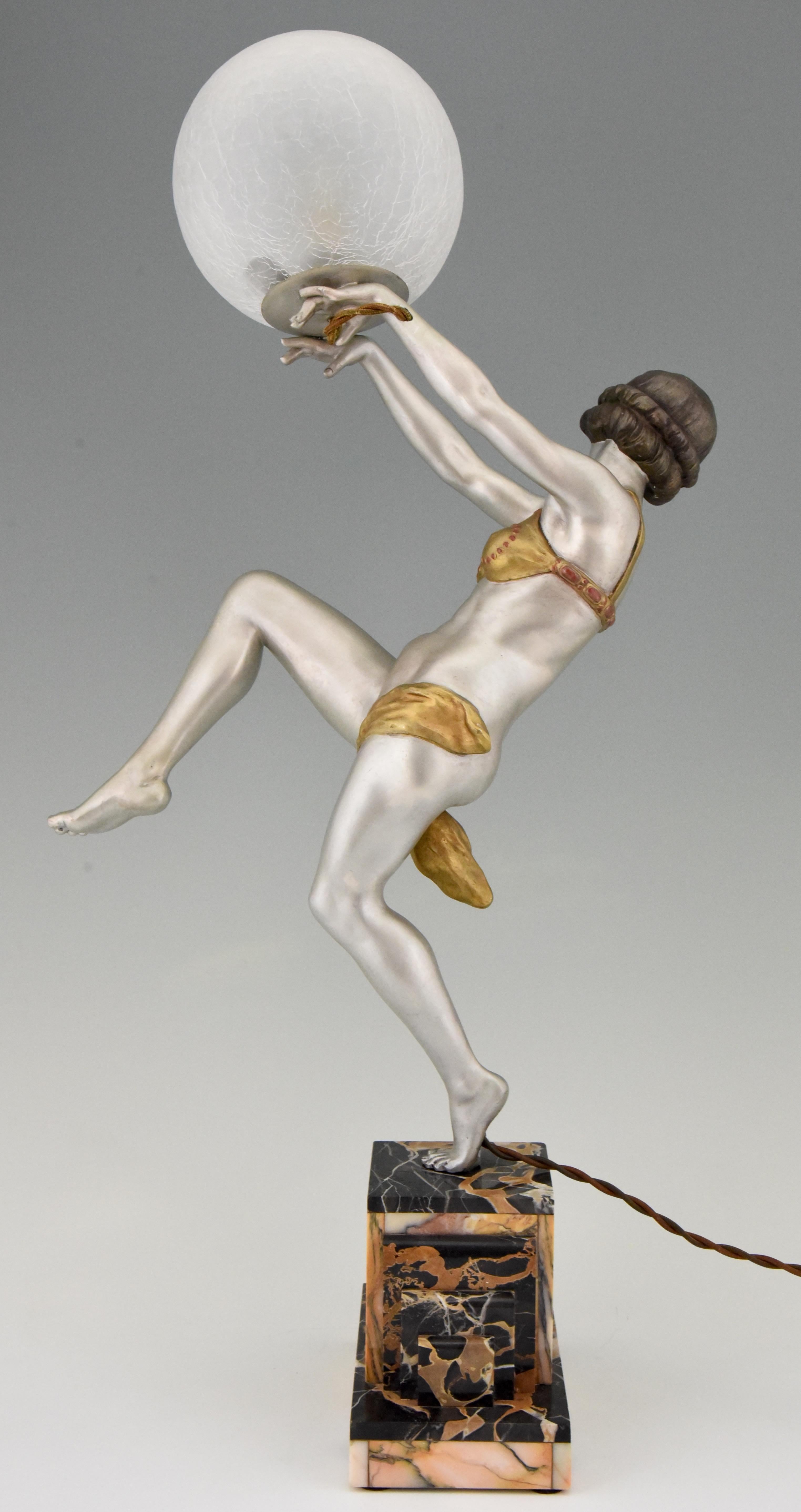 Patinated Art Deco Lamp Dancing Nude Lady Holding a Glass Ball Emile Carlier, France, 1930