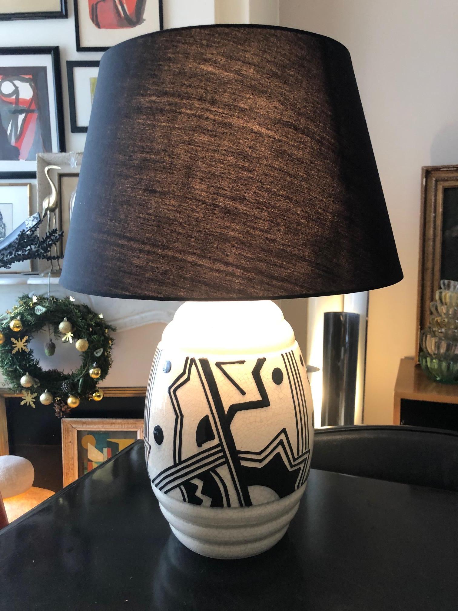 Beautiful graphic lamp from the 1930's, glazed crackled ceramic base 
New shade.